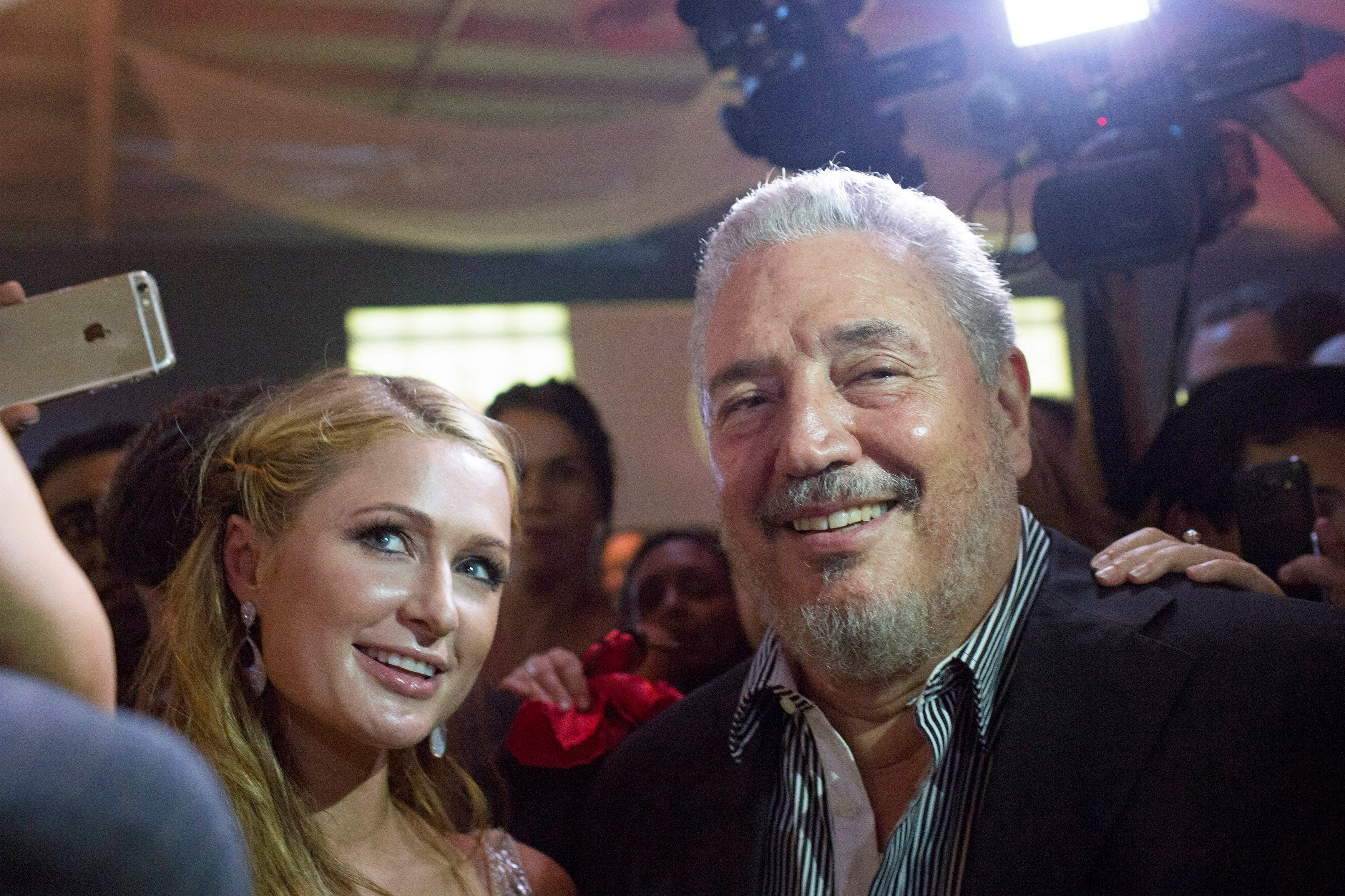 Fidel Castro Diaz-Balart, son of former Cuban leader Fidel Castro, poses with US socialite Paris Hilton as she takes a selfie during the gala dinner at the closing of the XVII Habanos Festival, in Havana, on February 27, 2015. Photo: Reuters