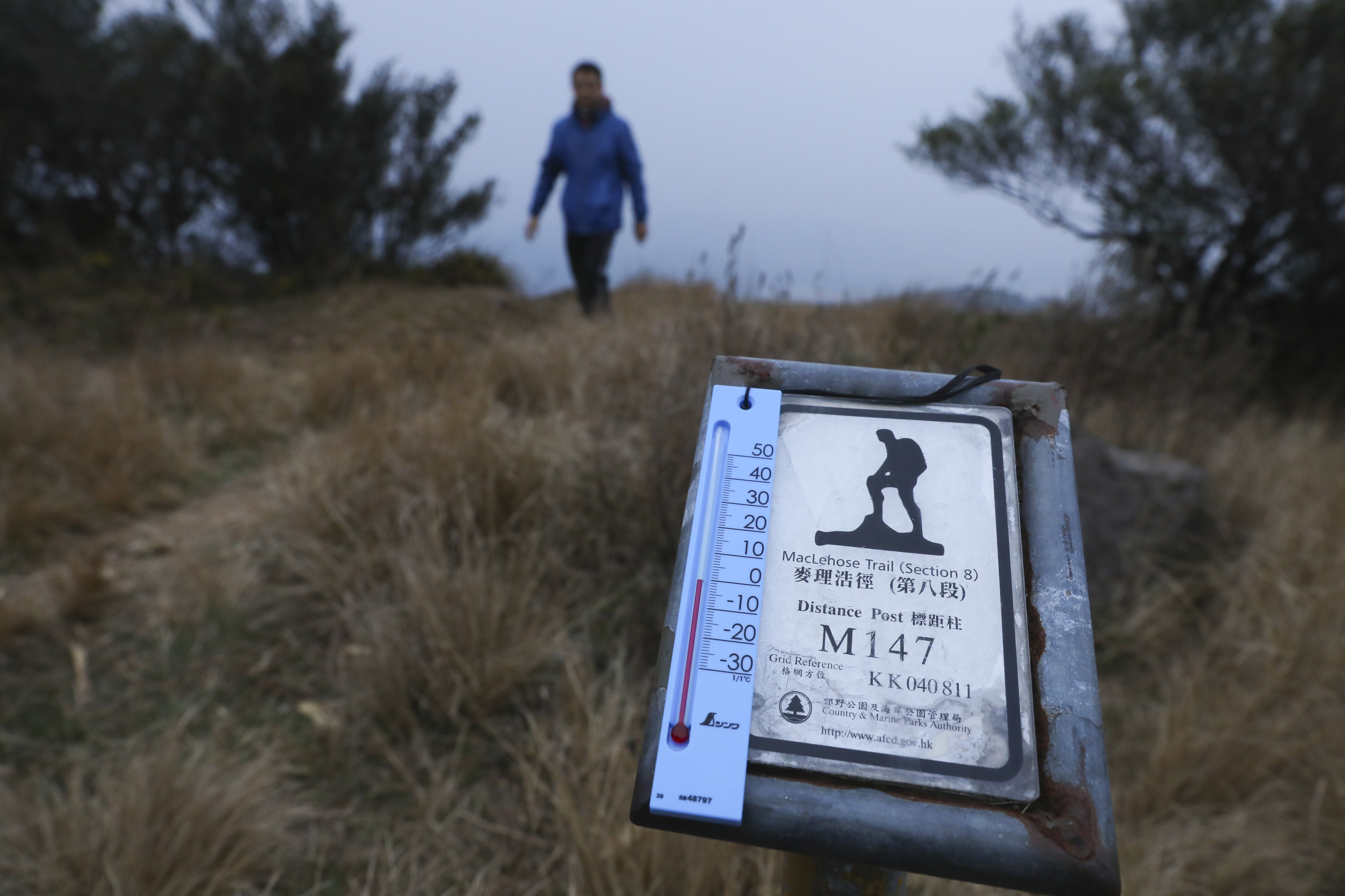 Walkers visit the peak of Tai Mo Shan to experience almost zero-degree temperatures early on Monday morning. Photo: Sam Tsang