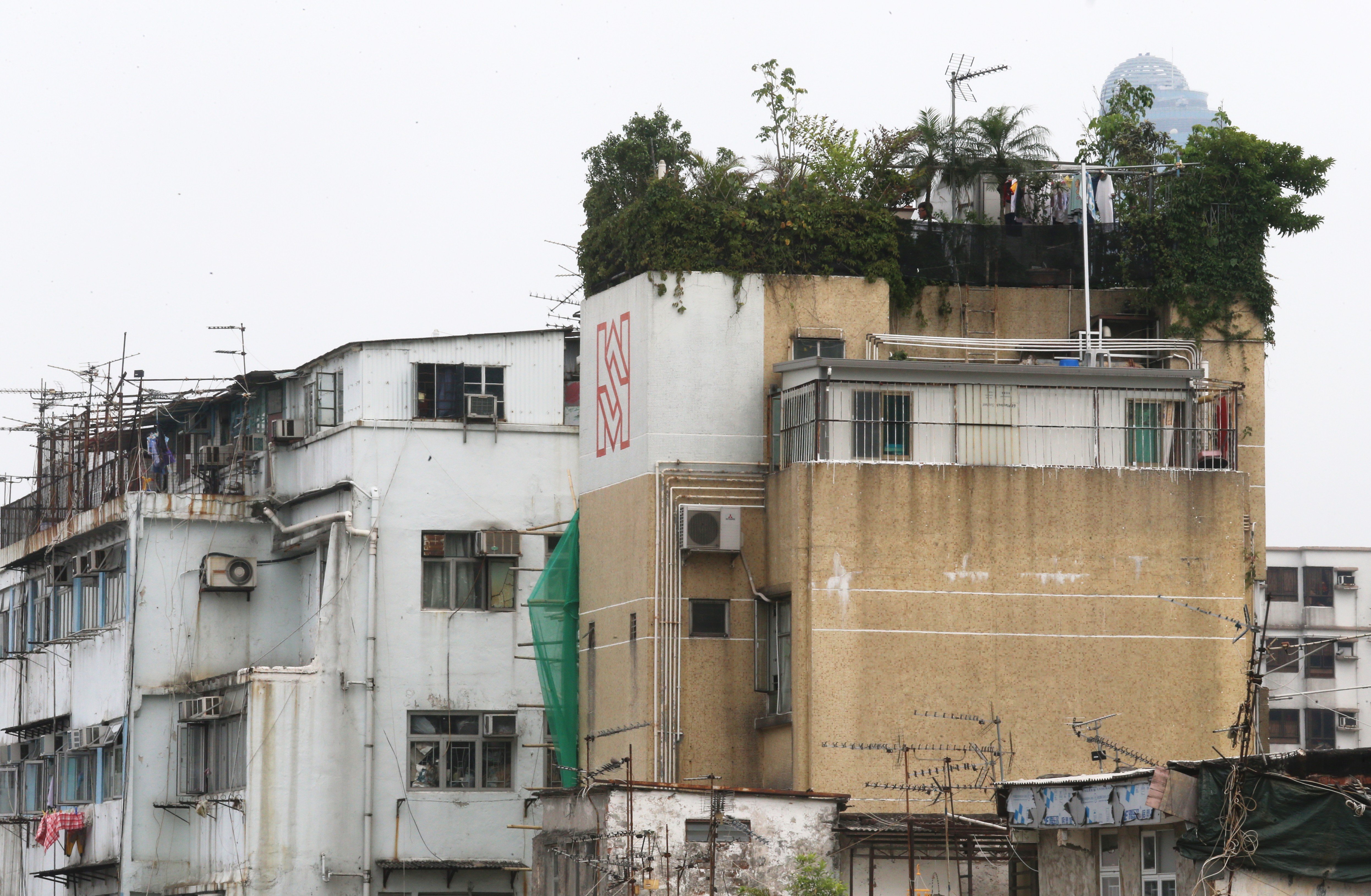 Illegal rooftop structures on a building in Sham Shui Po. Illegal structures are common in Hong Kong given the high cost of land. Photo: David Wong
