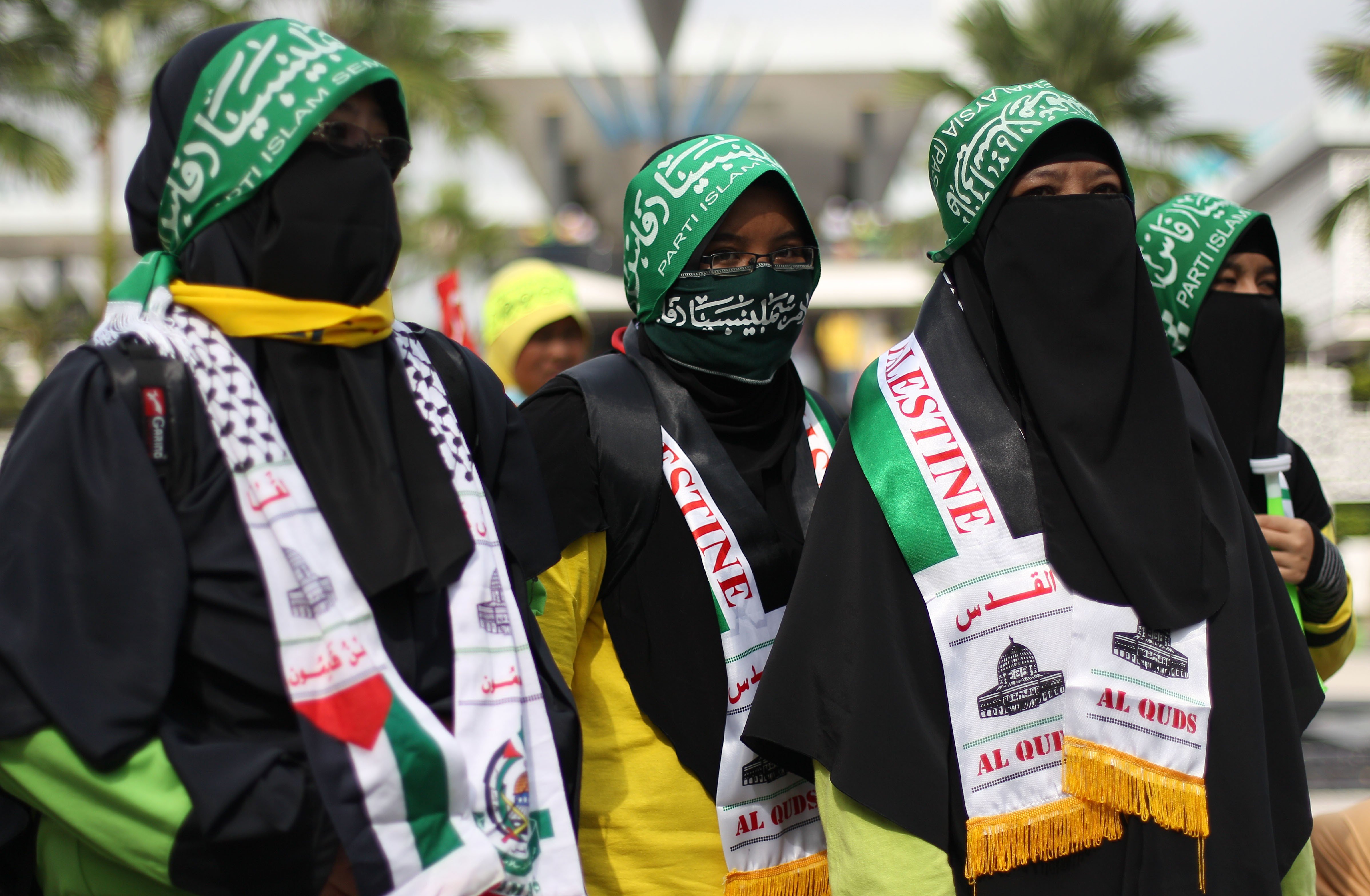 Protesters wearing headbands of the Parti Islam SeMalaysia demonstrate against a voting system they say is rigged in favour of the ruling Barisan Nasional coalition in 2013. Malaysia’s general election this year will be a test of the rise of political Islam in the country. Photo: AFP