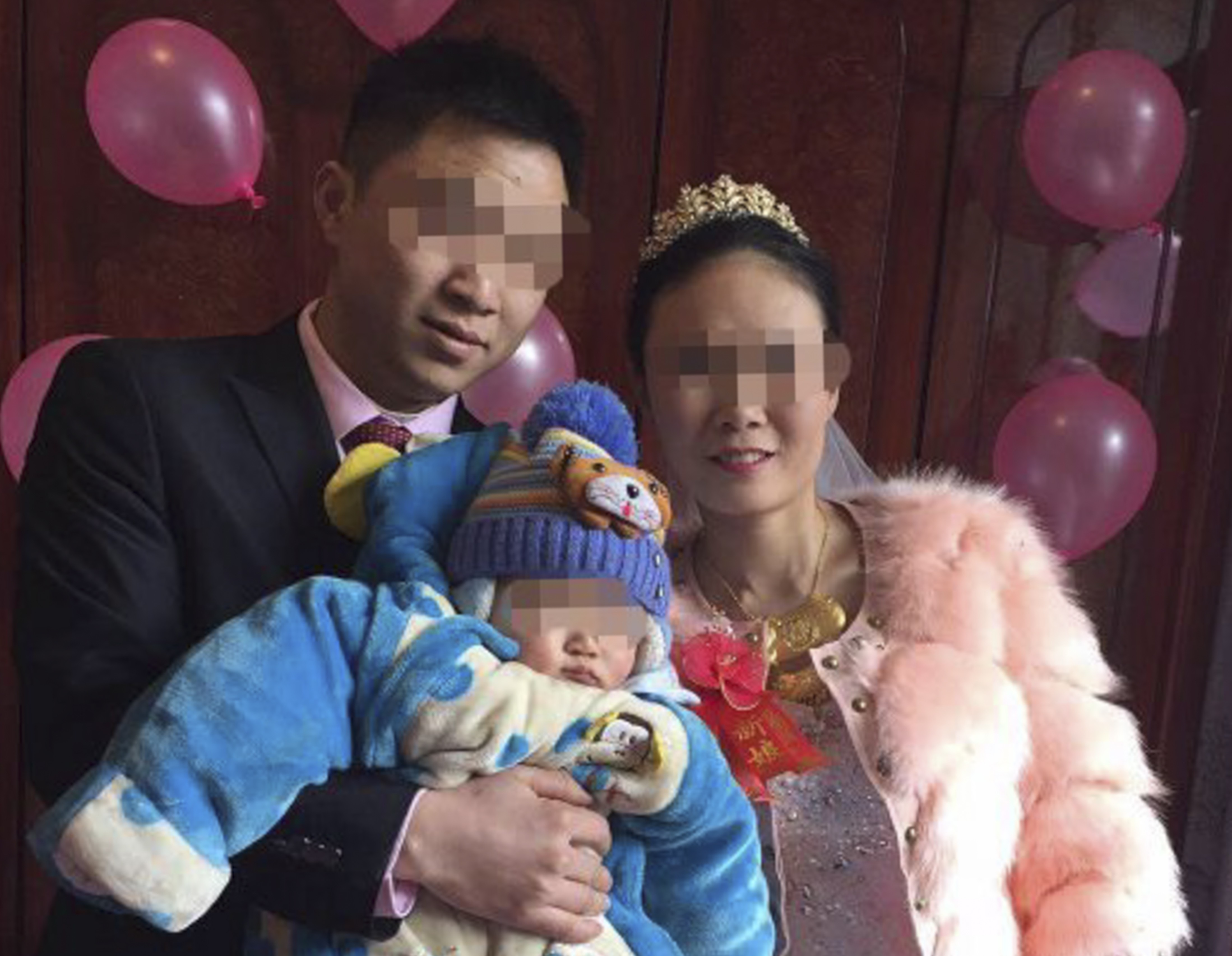 The man who died after drinking with colleagues, pictured with his wife and young child. Photo: Sohu.com