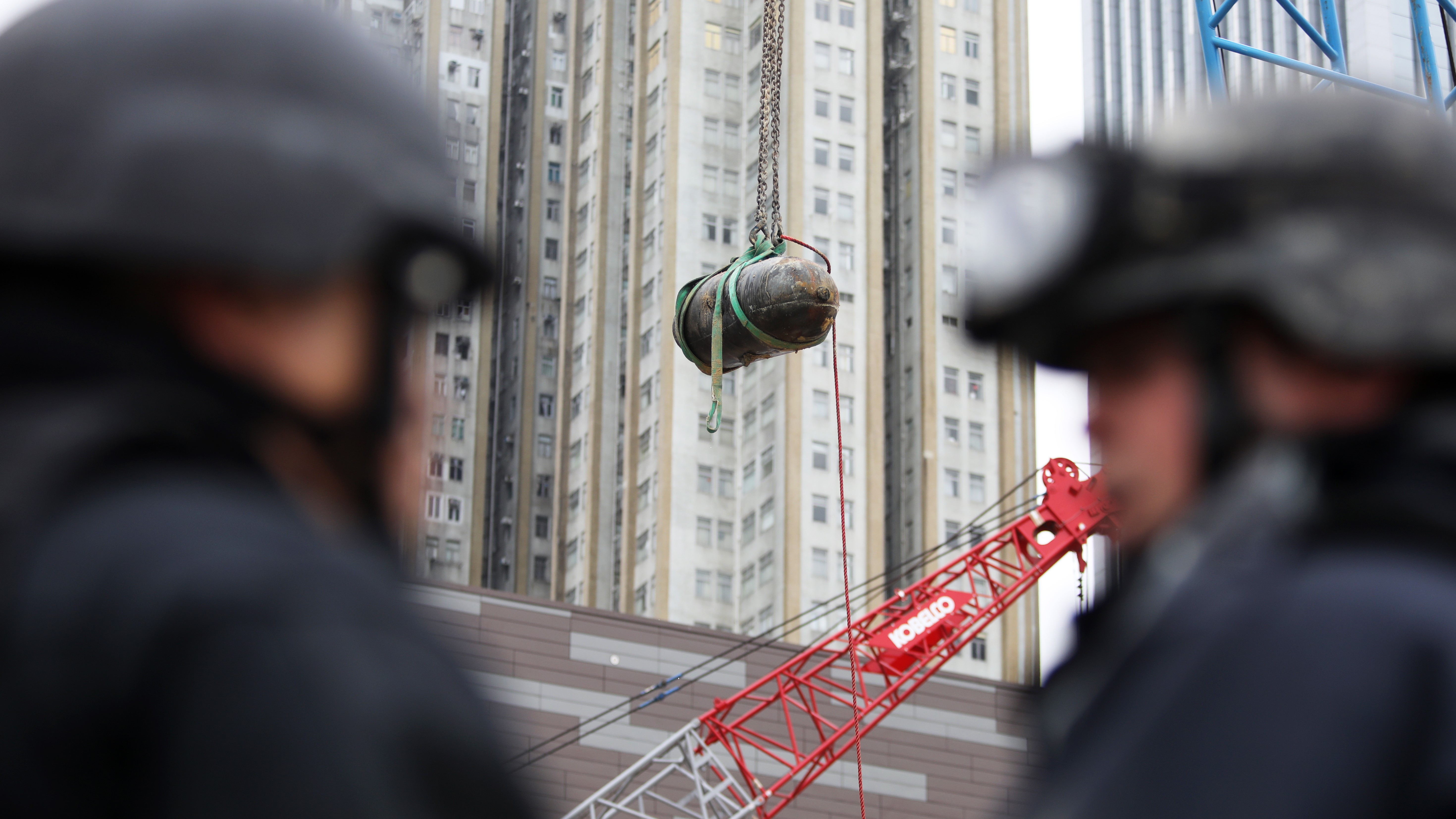 A bomb from the second world war is removed from the Sha Tin-Central rail link construction site in Wan Chai. Photo: Sam Tsang