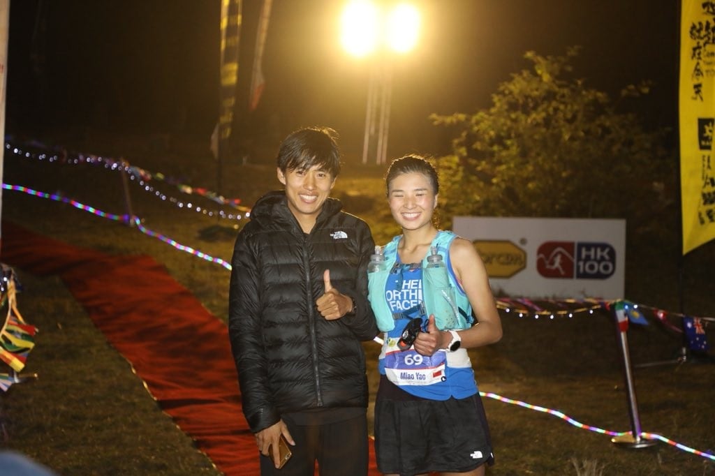 Qi Min and Yao Miao at the finish line of the HK100. Photo: Twitter/@iRunFar