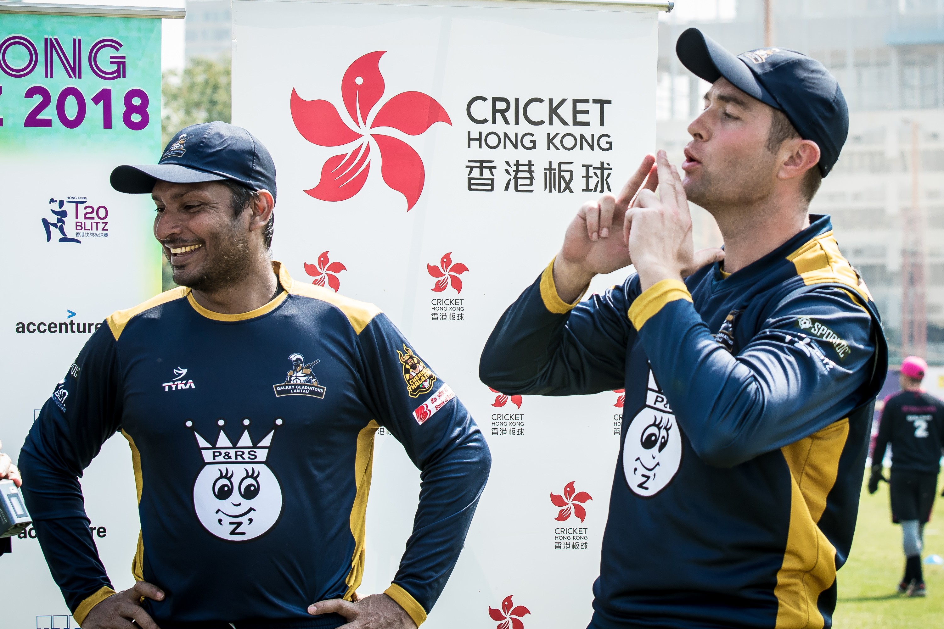 Man of the match Dan Pascoe (right) does his gunman celebration at the post-match ceremony with Kumar Sangakkara. Photo: Ike Images