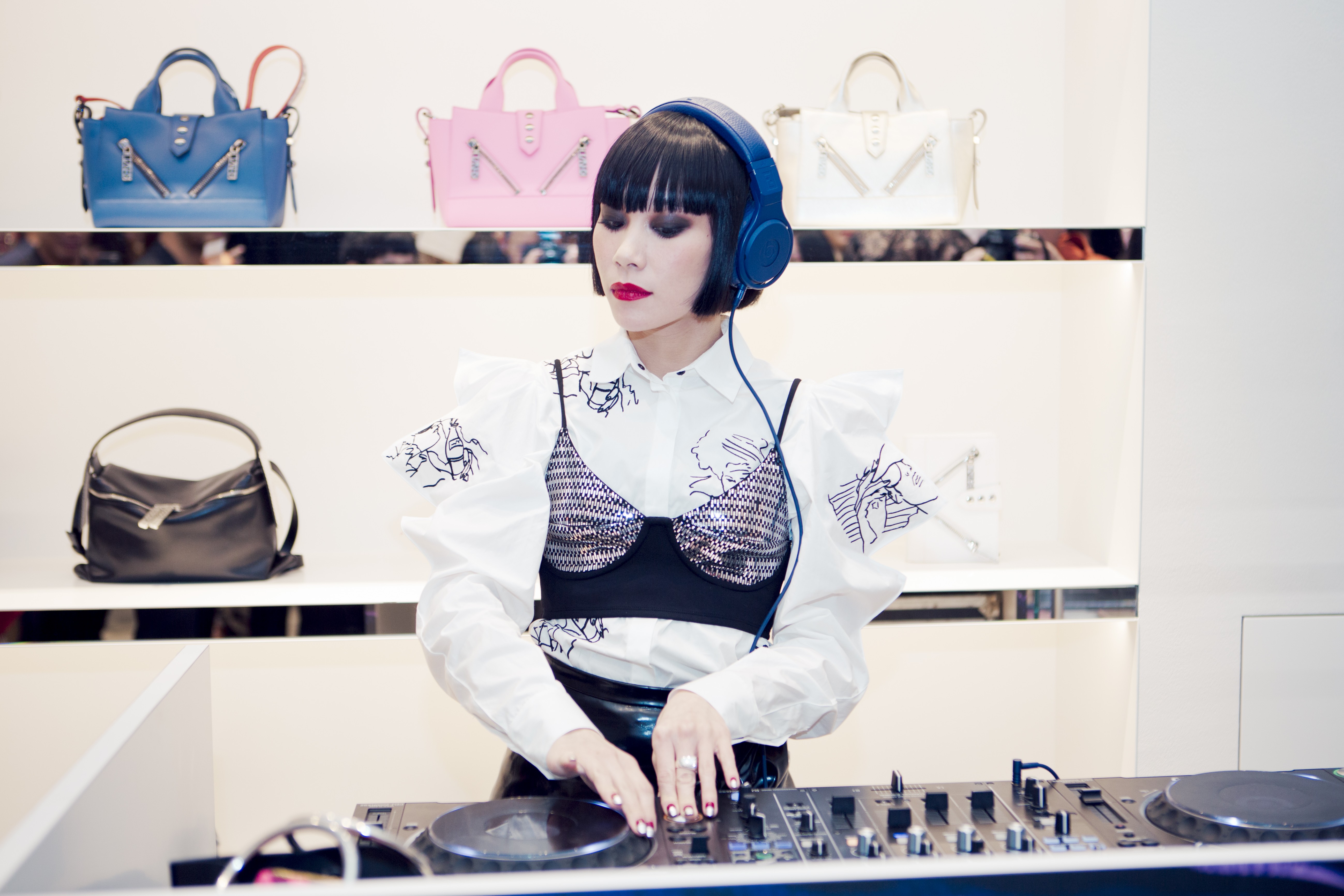 Mademoiselle Yulia DJs at a Kenzo event.