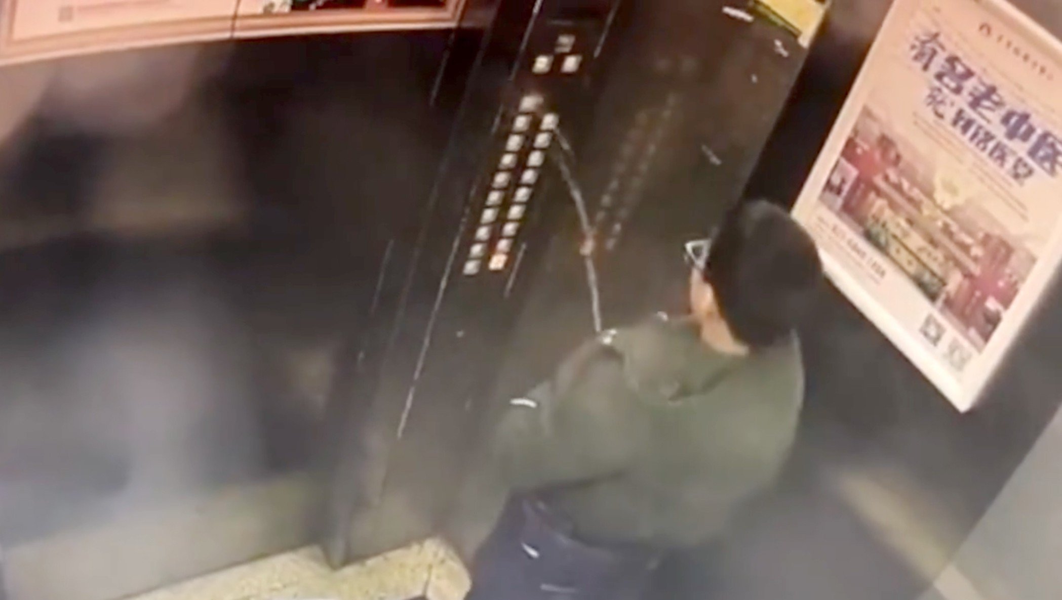 A boy from Chongqing in southwest China became trapped in a lift after urinating all over the control panel, causing it to short circuit. Photo: Pearvideo