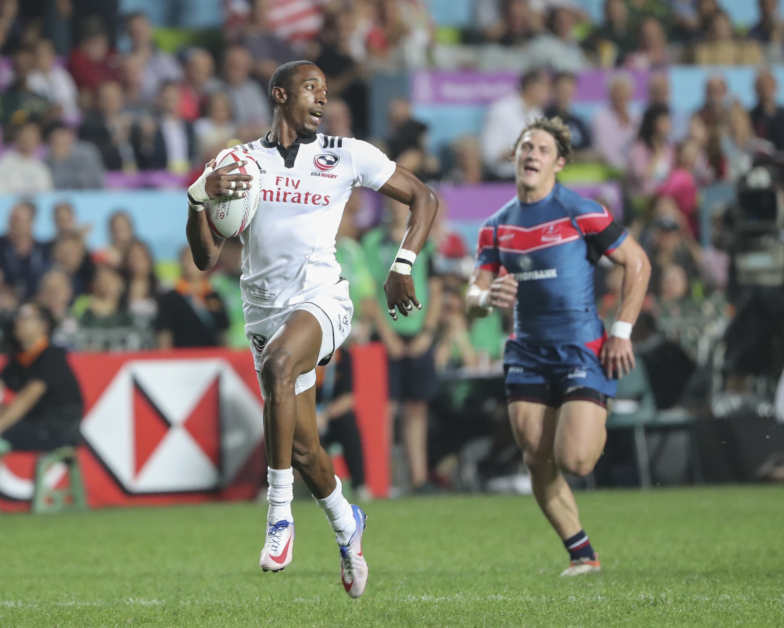 USA speedster Perry Baker streaks away for another try at the Cathay Pacific/HSBC Hong Kong Sevens. Photo: Edward Wong