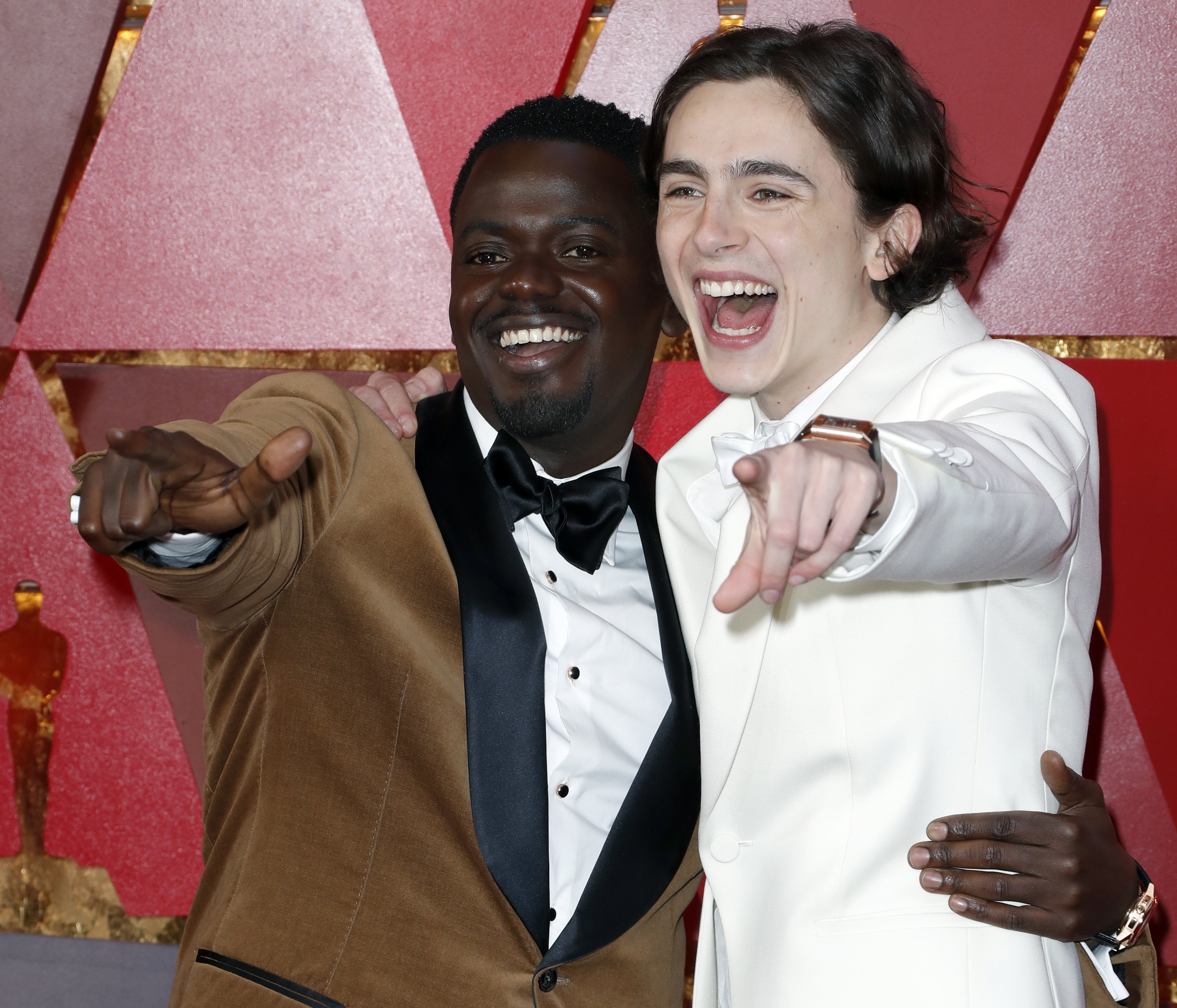 Best actor nominees Daniel Kaluuya (left) and Timothee Chalamet share a light moment on the red carpet. Photo: EPA
