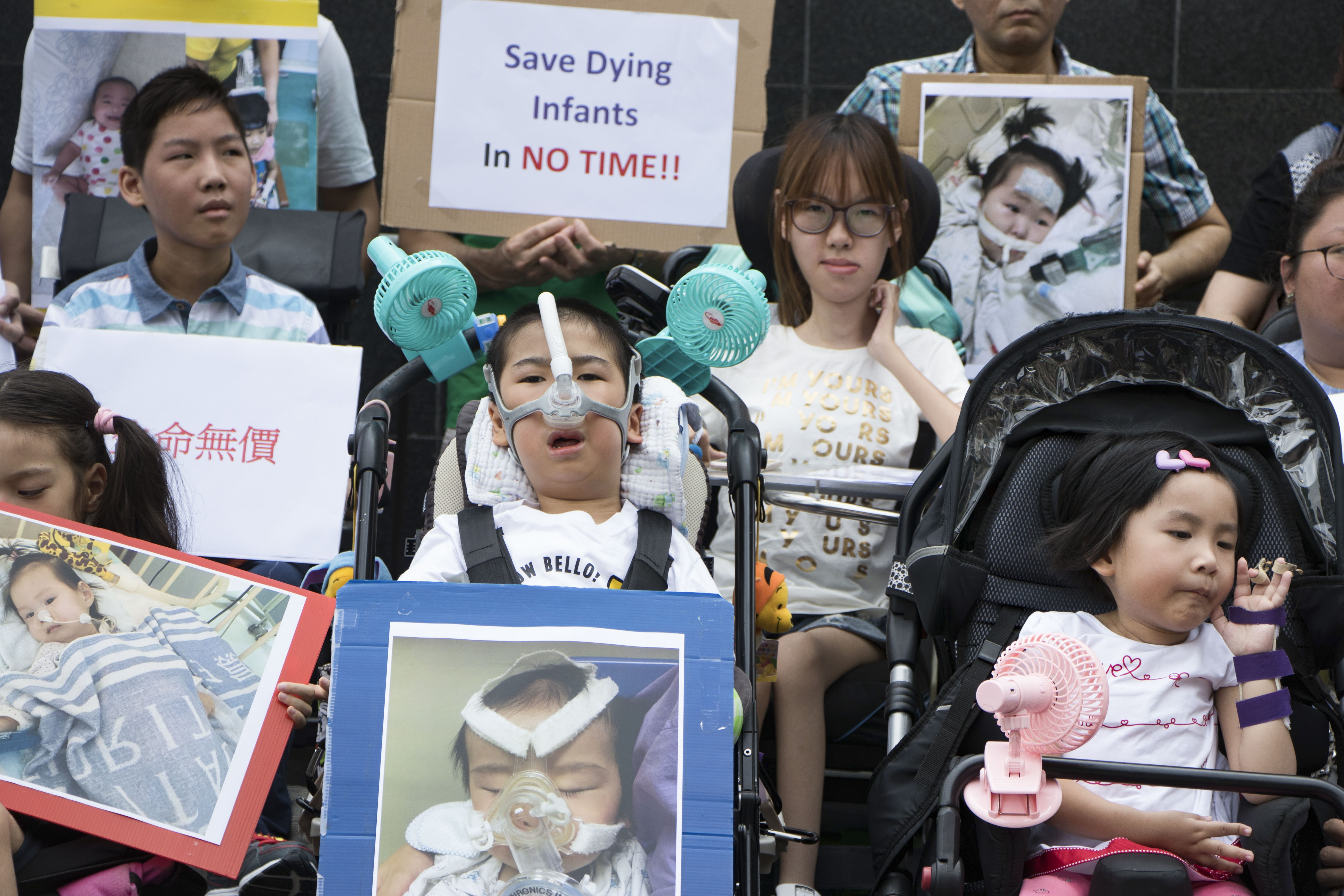 Children suffering from spinal muscular atrophy rally outside the government headquarters in Admiralty for more support in October 2017. Photo: Kwok Wing-kin