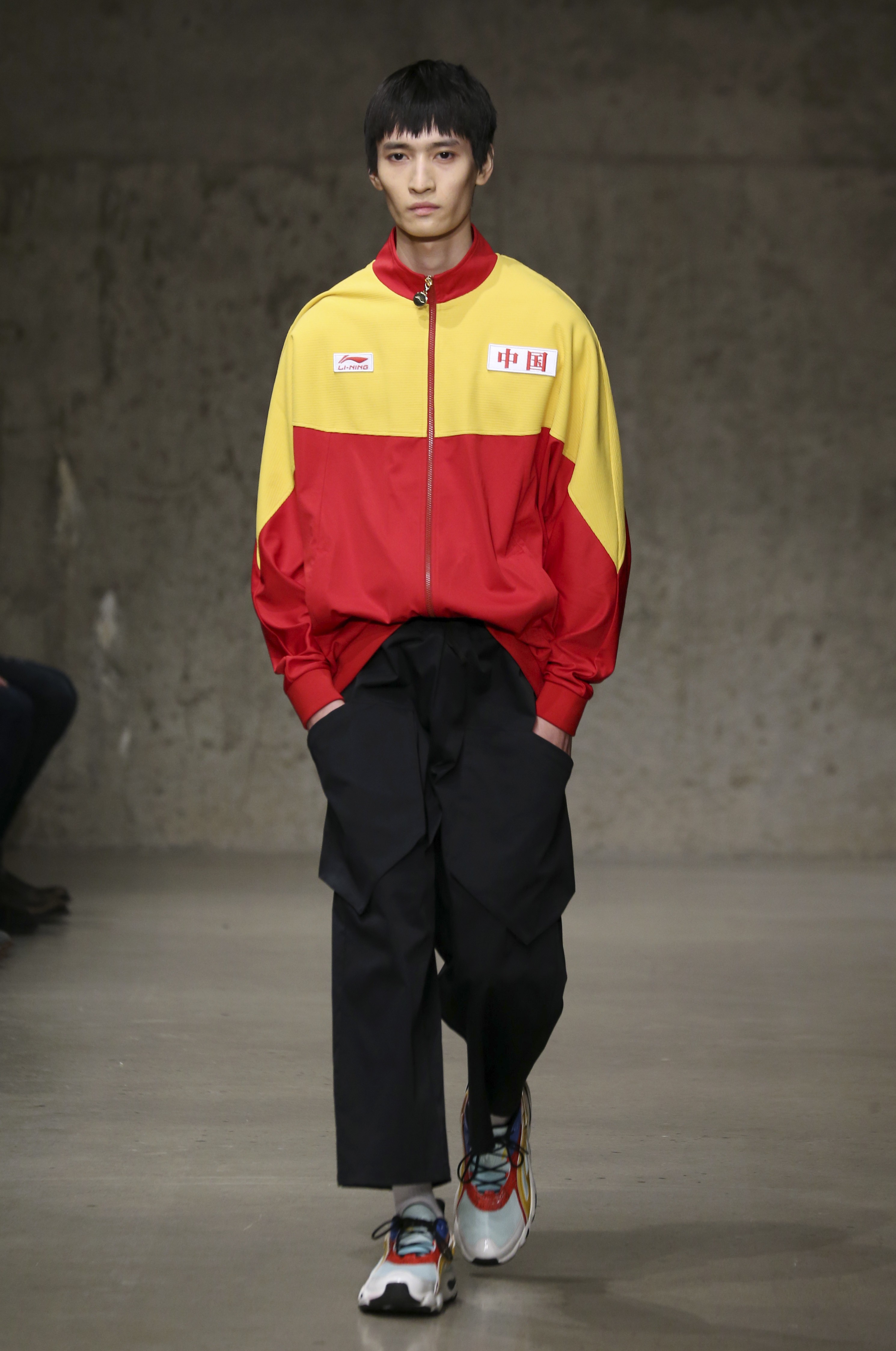Established brands and emerging designers are playing to the national pride of Chinese youth by emblazoning Chinese characters on their fashions and using the colours of the national flag