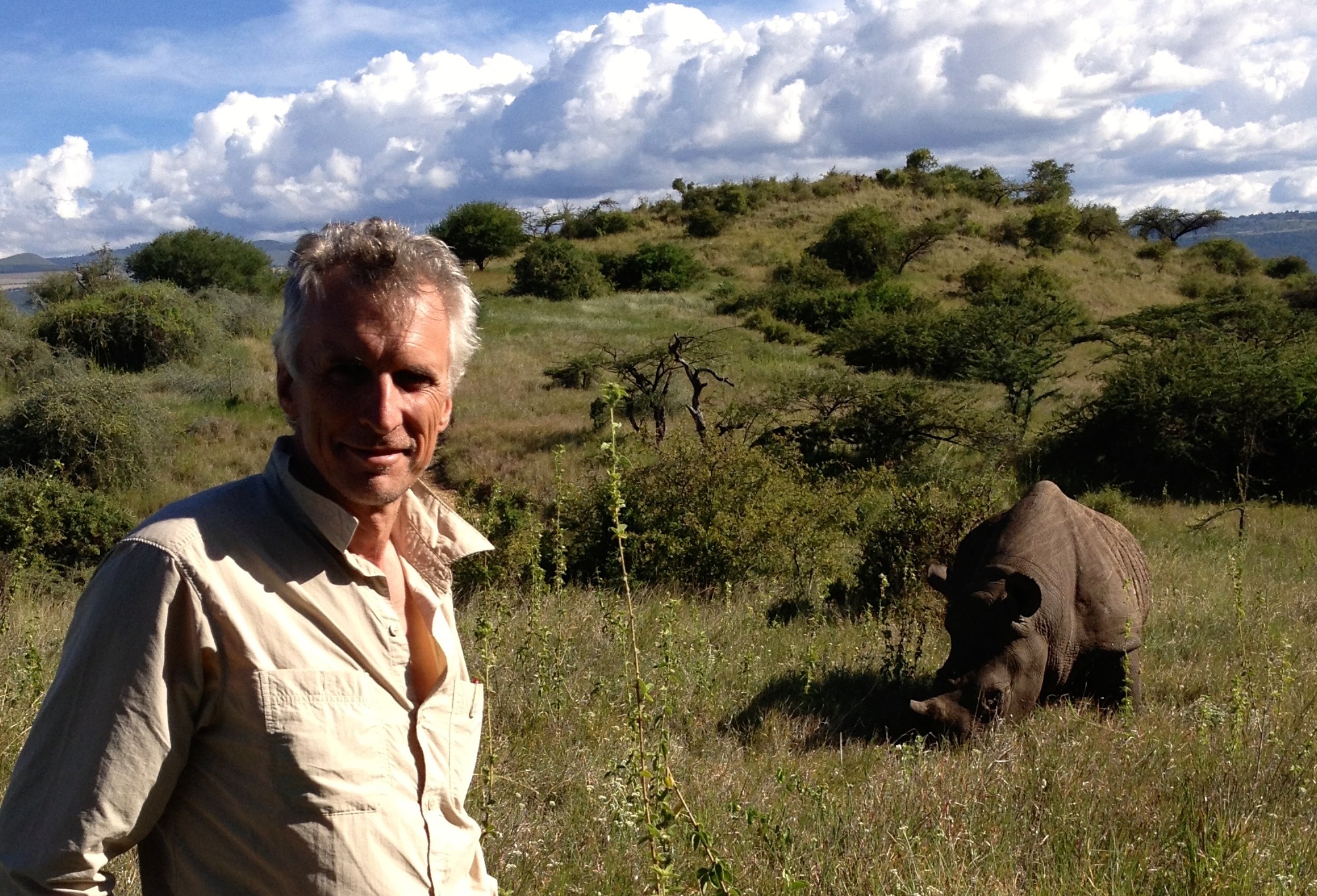 Paul McIntosh with an orphaned black rhino at Lewa during filming of Running Wild – it has since returned to the wild.