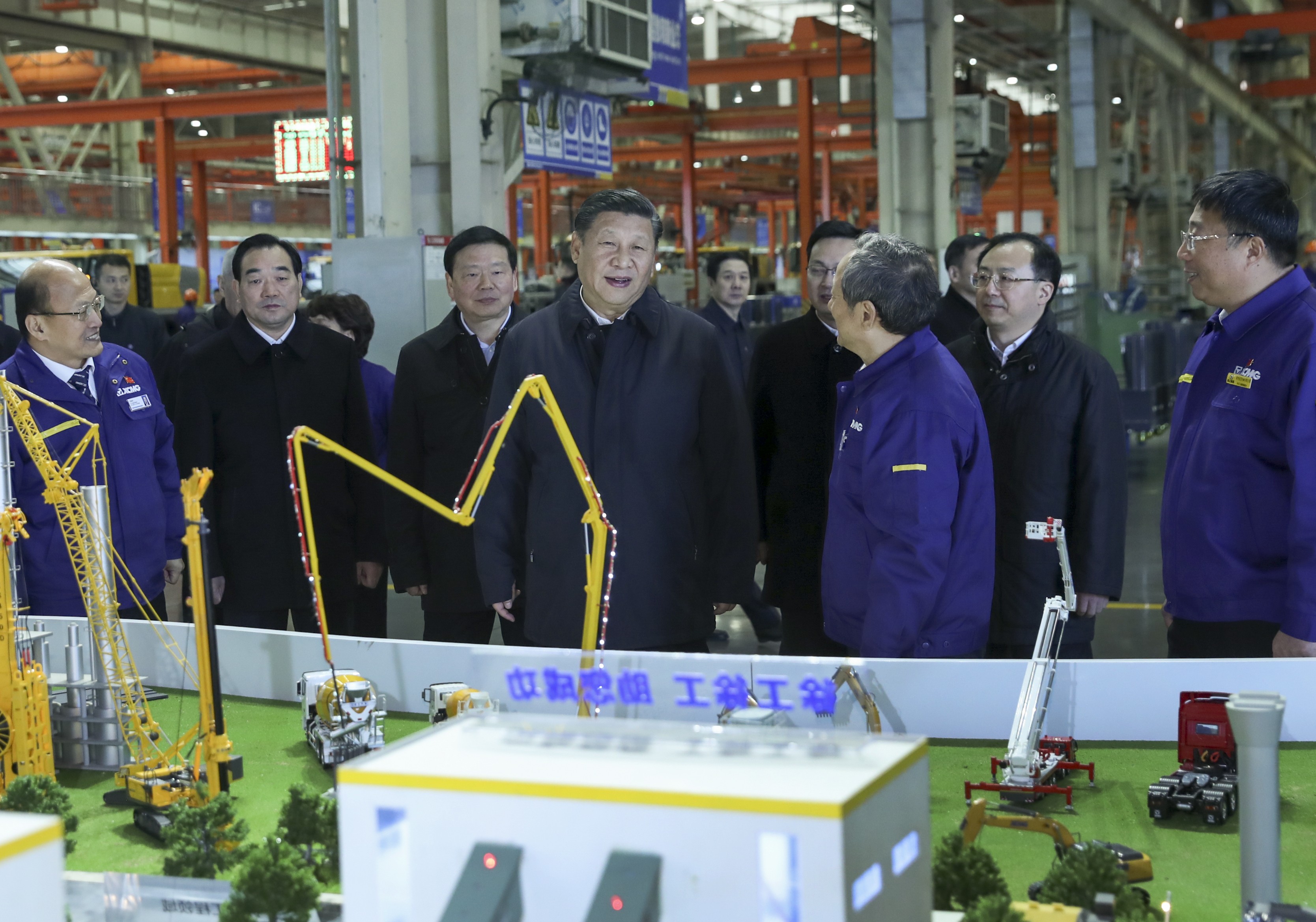 Chinese President Xi Jinping hears how the Xuzhou Construction Machinery Group is participating in the belt and road construction while visiting the company plant in Xuzhou, Jiangsu province, last December. Photo: Xinhua