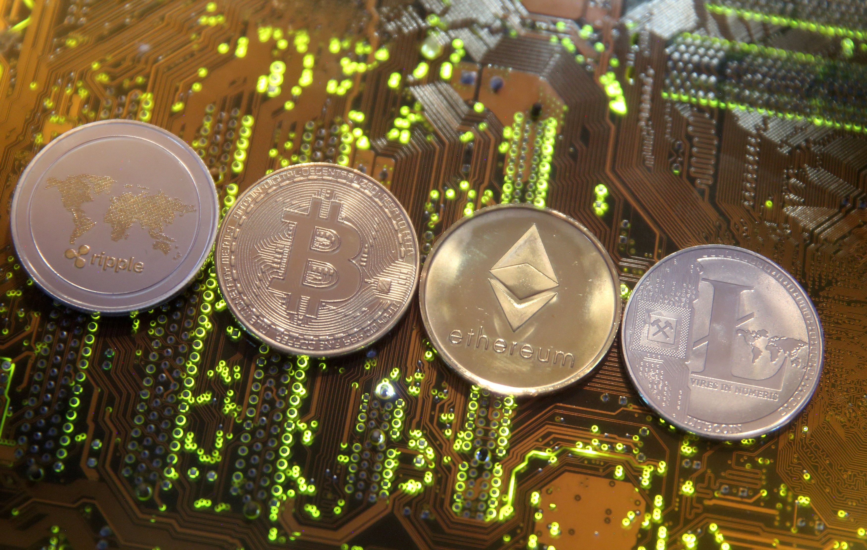 Representations of the Ripple, bitcoin, Etherum and Litecoin virtual currencies. While developed economies are slower to act, smaller and emerging economies are fashioning themselves as crypto-friendly hubs. Photo: Reuters