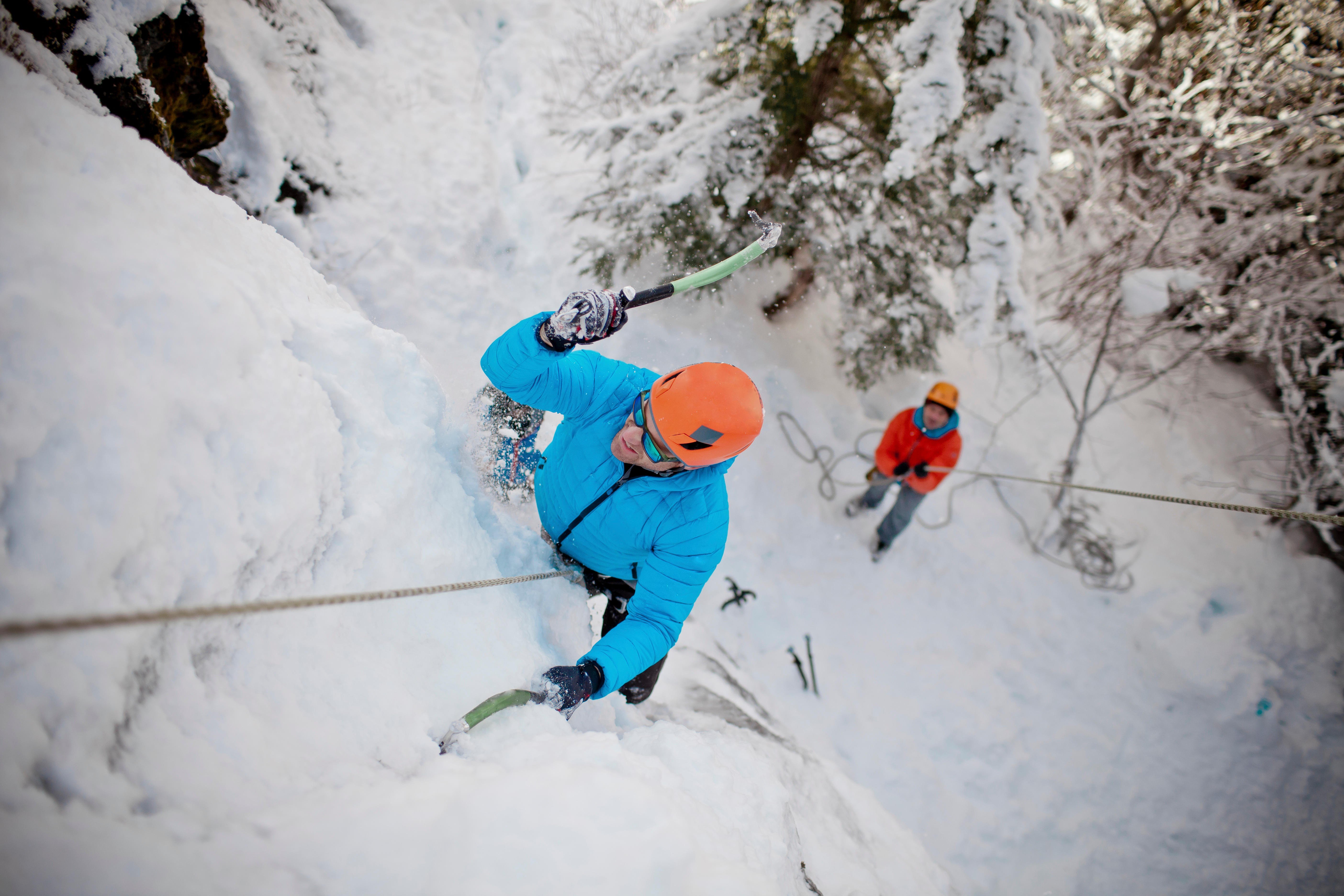Sharp axes, crampons and safety equipment are all essential for ice climbing – especially a helmet to protect you from falling chunks of ice of varying sizes. Photo: Alamy