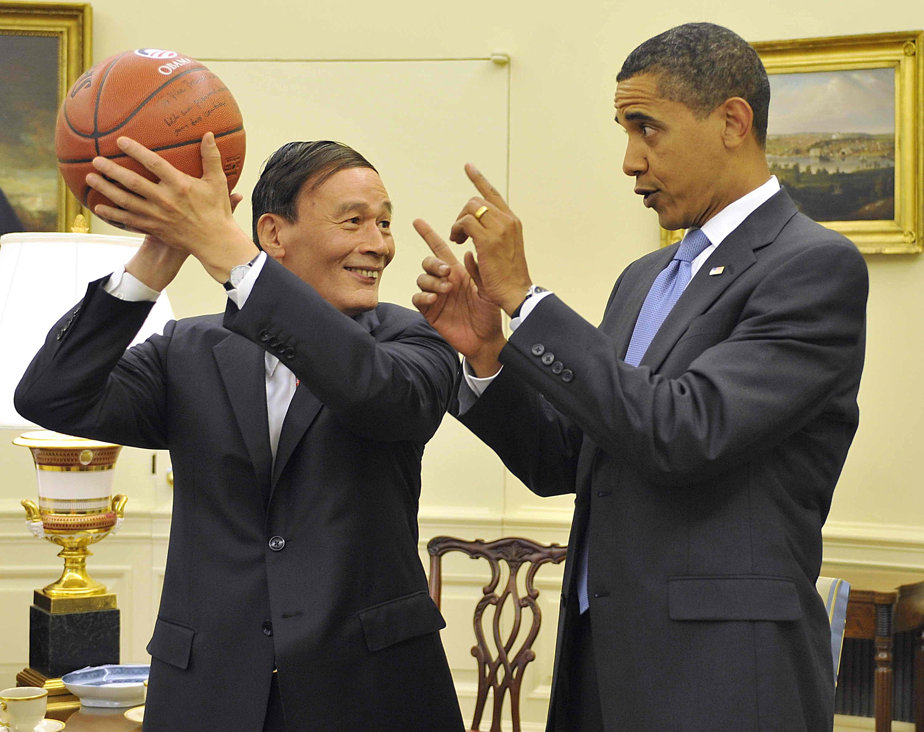 Wang Qishan is given a basketball by then US president Barack Obama in Washington in 2009. As vice-premier at the time, Wang managed economic issues and led trade talks with the EU and US. Photo: Xinhua