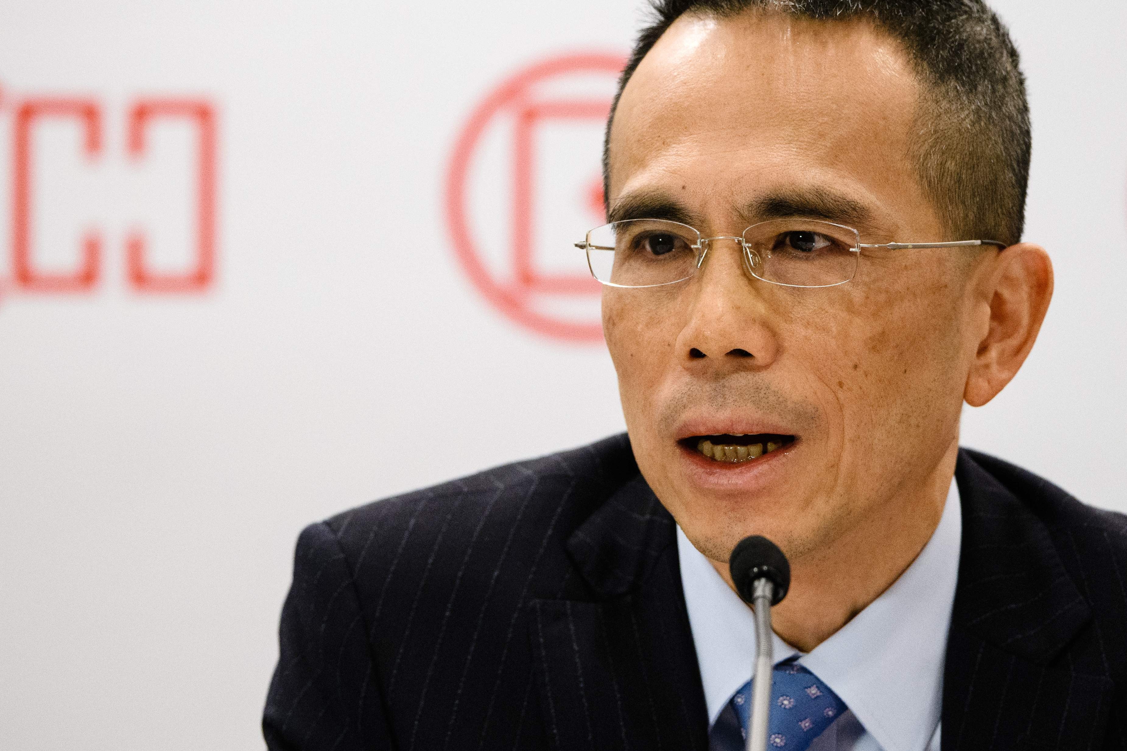 Victor Li, son of Hong Kong’s richest man Li Ka-shing, speaks during a press conference in Hong Kong on Friday. Li Ka-shing announced he was stepping down as chairman of his flagship company CK Hutchison, and will hand over the reins to Victor. Photo: AFP
