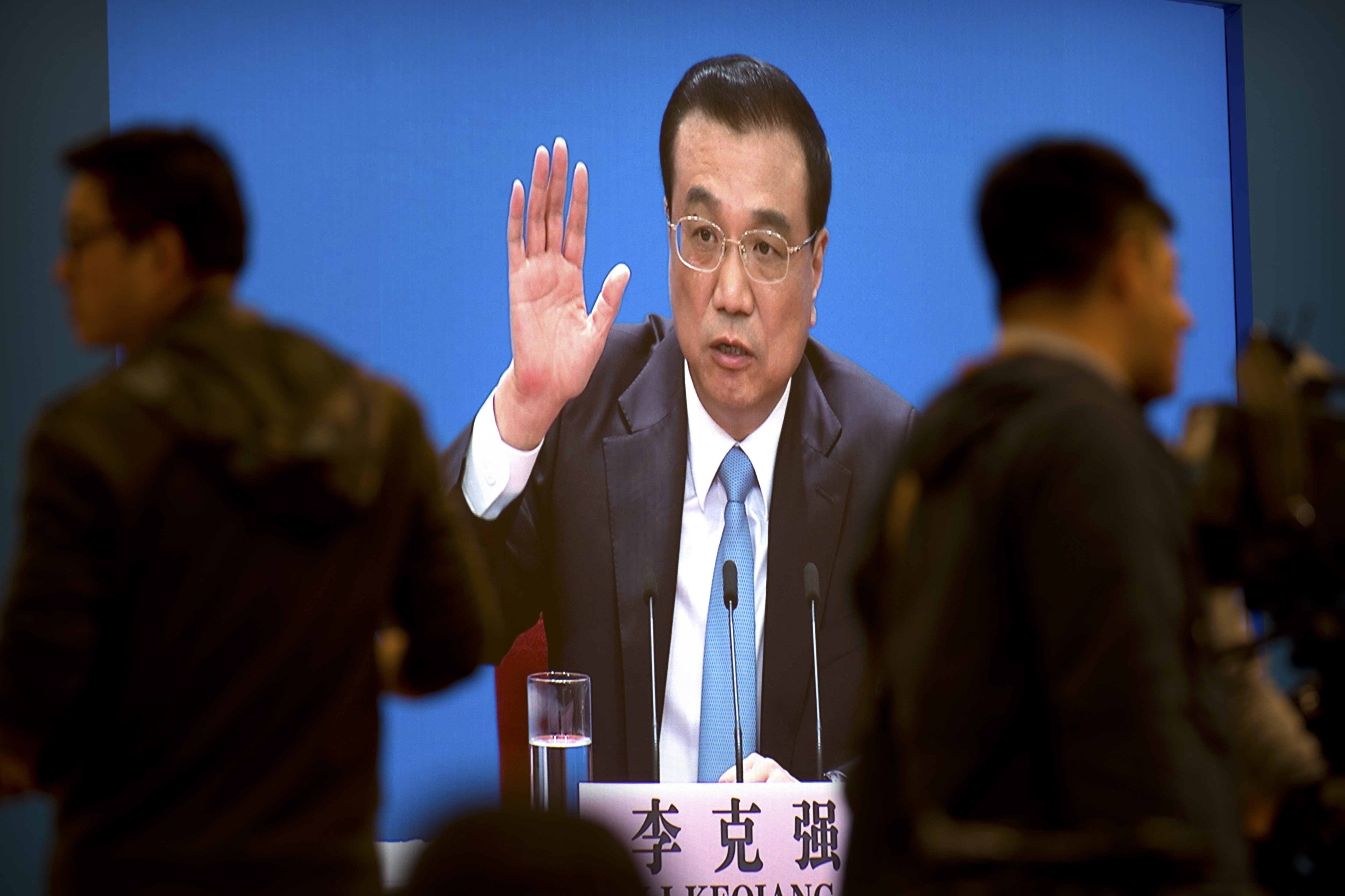 Premier Li Keqiang is shown on a large screen as he speaks during a press conference in Beijing on Tuesday. Photo: AP