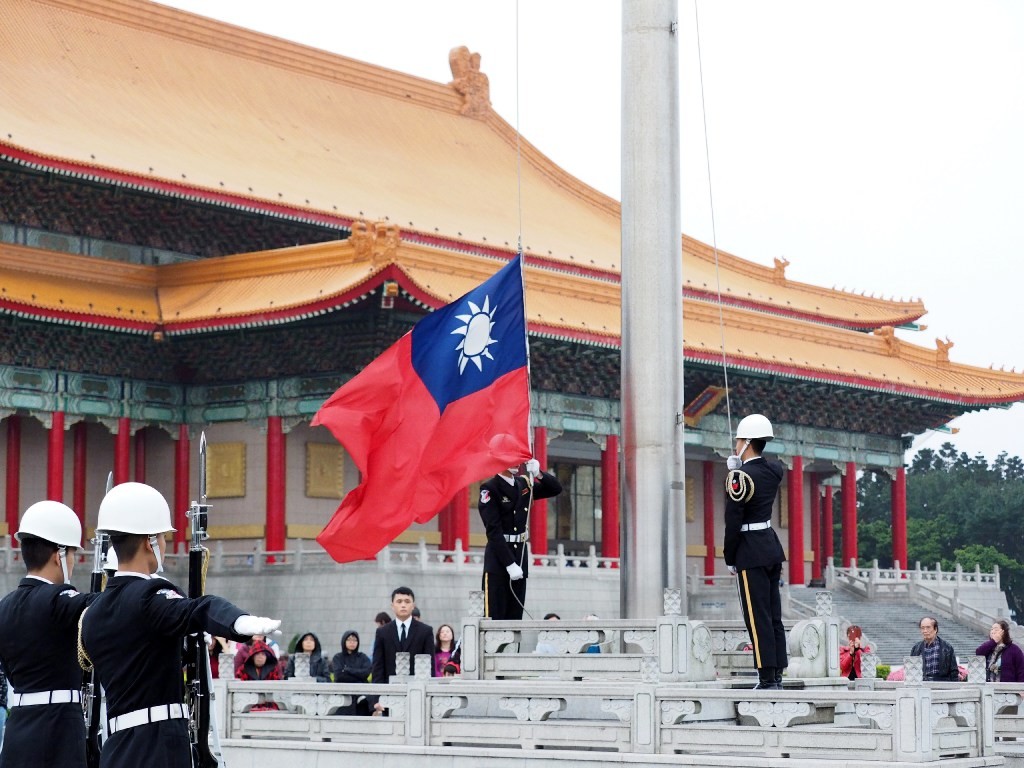 Soldiers lower Taiwan’s national flag at Liberty Square in Taipei, on March 7. Photo: EPA-EFE