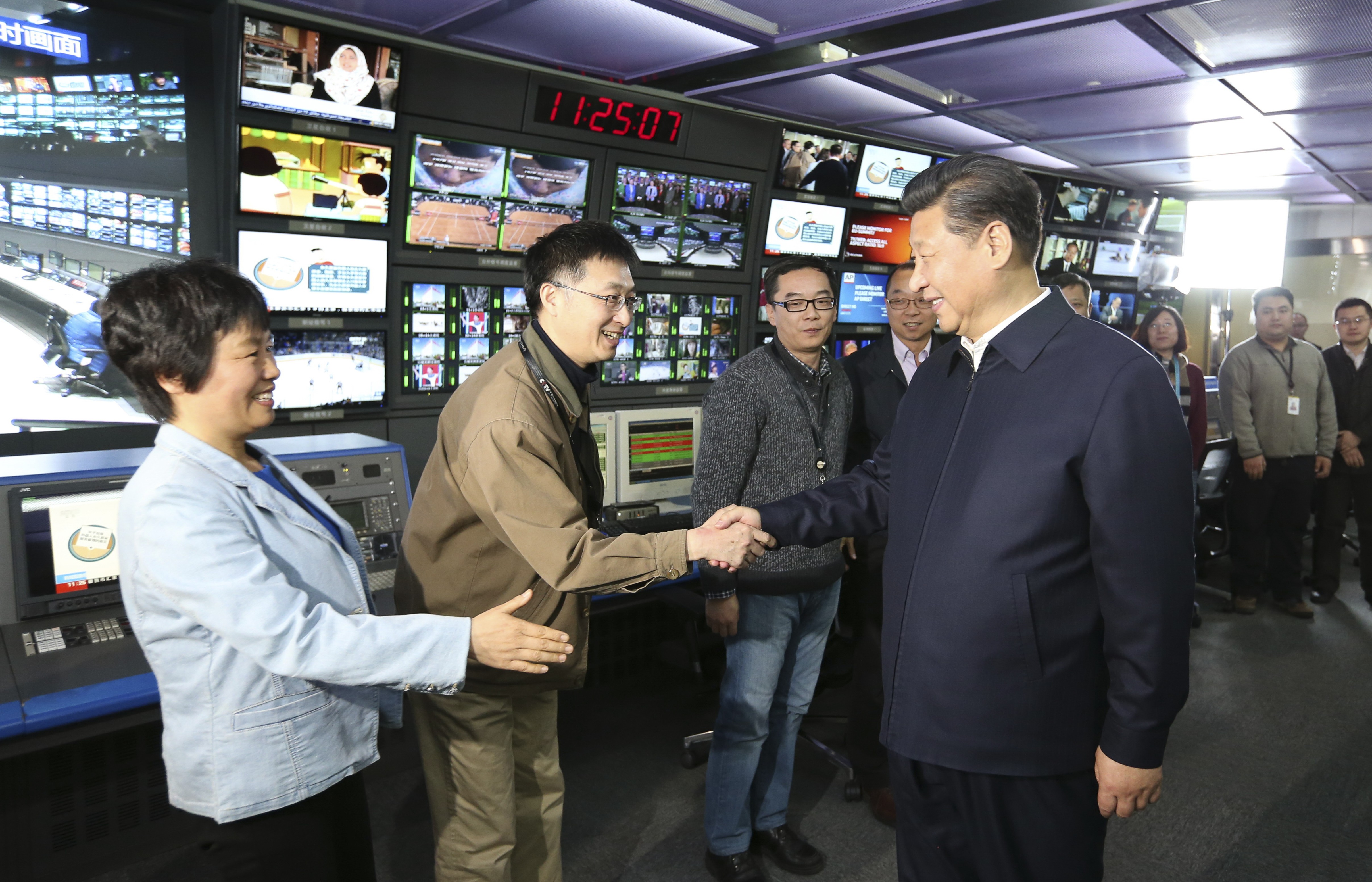 Xi Jinping shakes hands with staff in the control room of China Central Television in Beijing during a high-profile tour of the top three state media outlets in 2016. Photo: Xinhua via AP