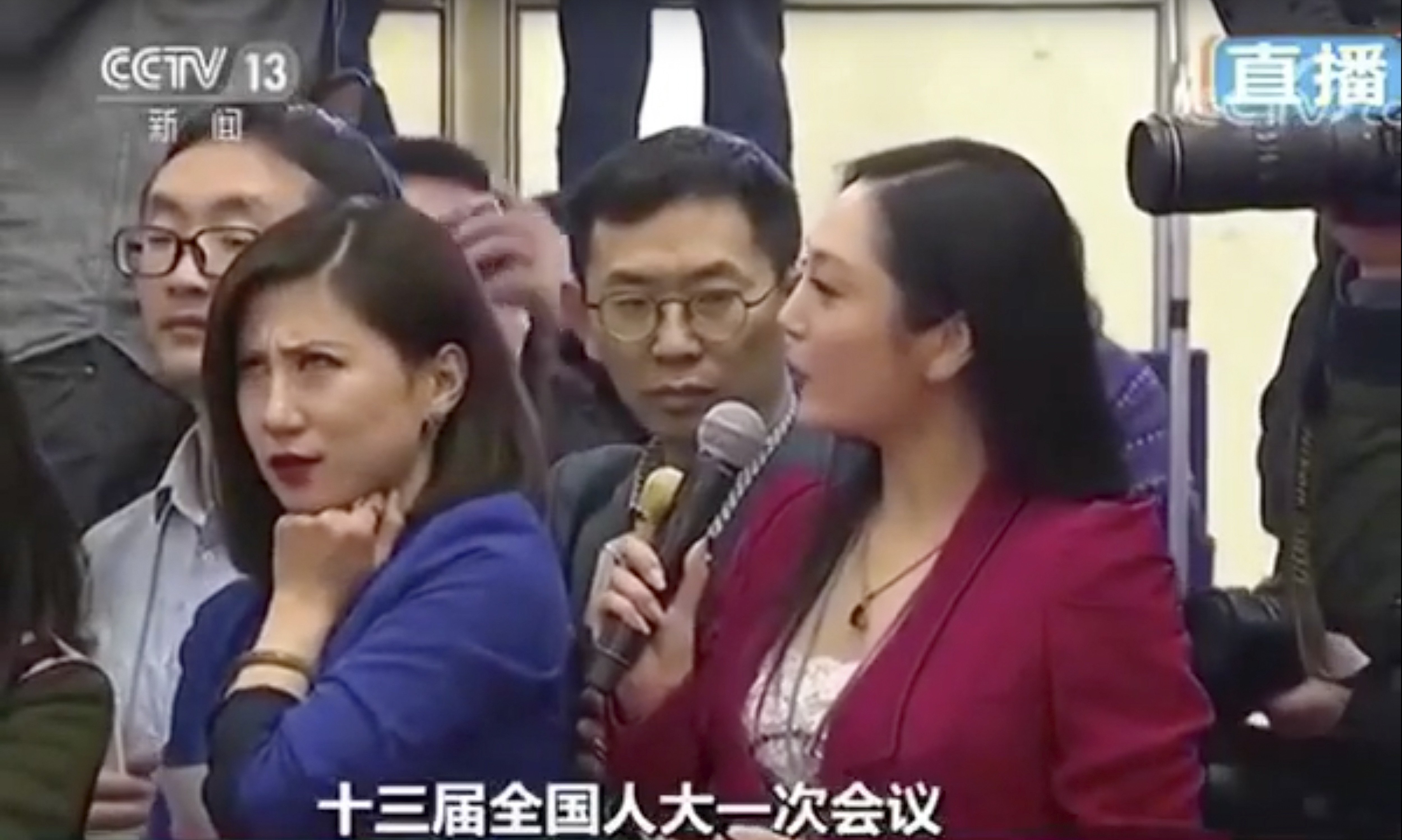 Liang Xiangyi, a reporter for China Business News, gives an epic eye-roll as fellow journalist Zhang Huijun asks a tedious question to a government minister. Photo: CCTV