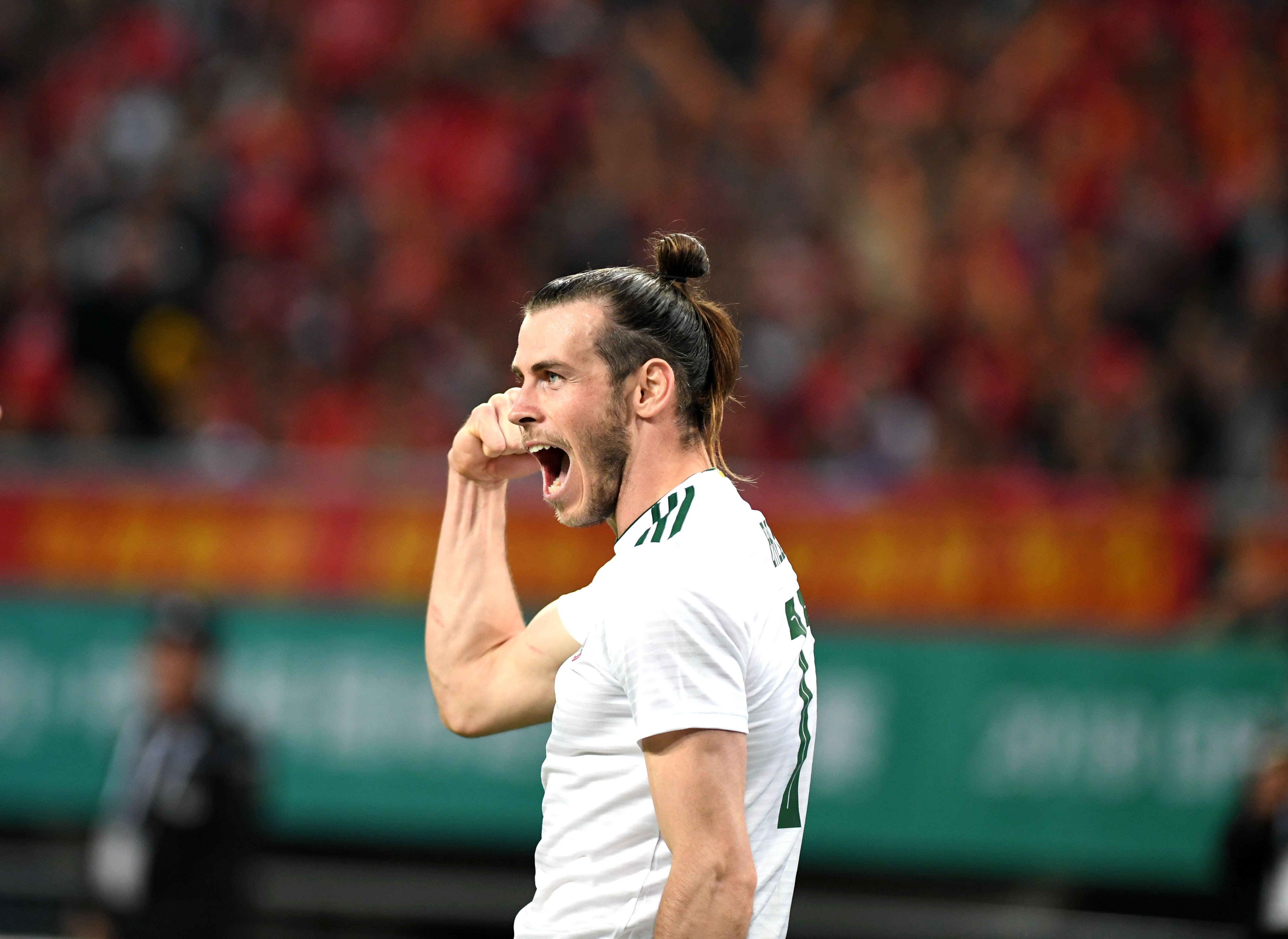 Gareth Bale was too strong for China as he and his Wales teammates ran rampage in Nanning. Photo: Xinhua