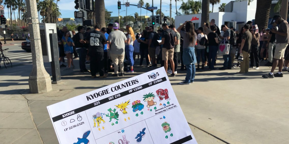 A large group prepares to take on the legendary Pokémon Kyogre on the Santa Monica Pier. The flyer, handed out by a Pokémon Go enthusiast group, lists its weaknesses. Photo: Matt Weinberger/Business Insider