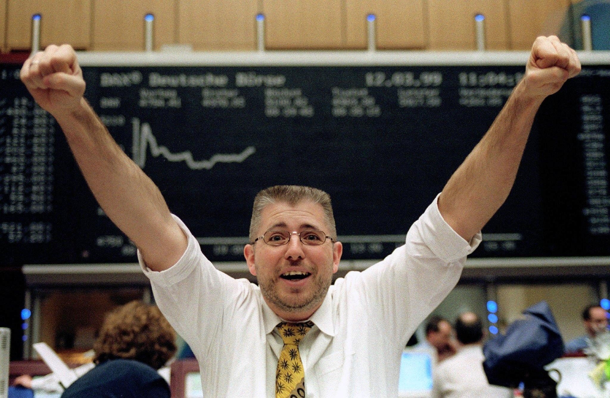A German equities trader celebrating on March 12, 1999 after the market rose 5 per cent. Since 1900 no other investment class has consistently outperformed. Photo: AFP