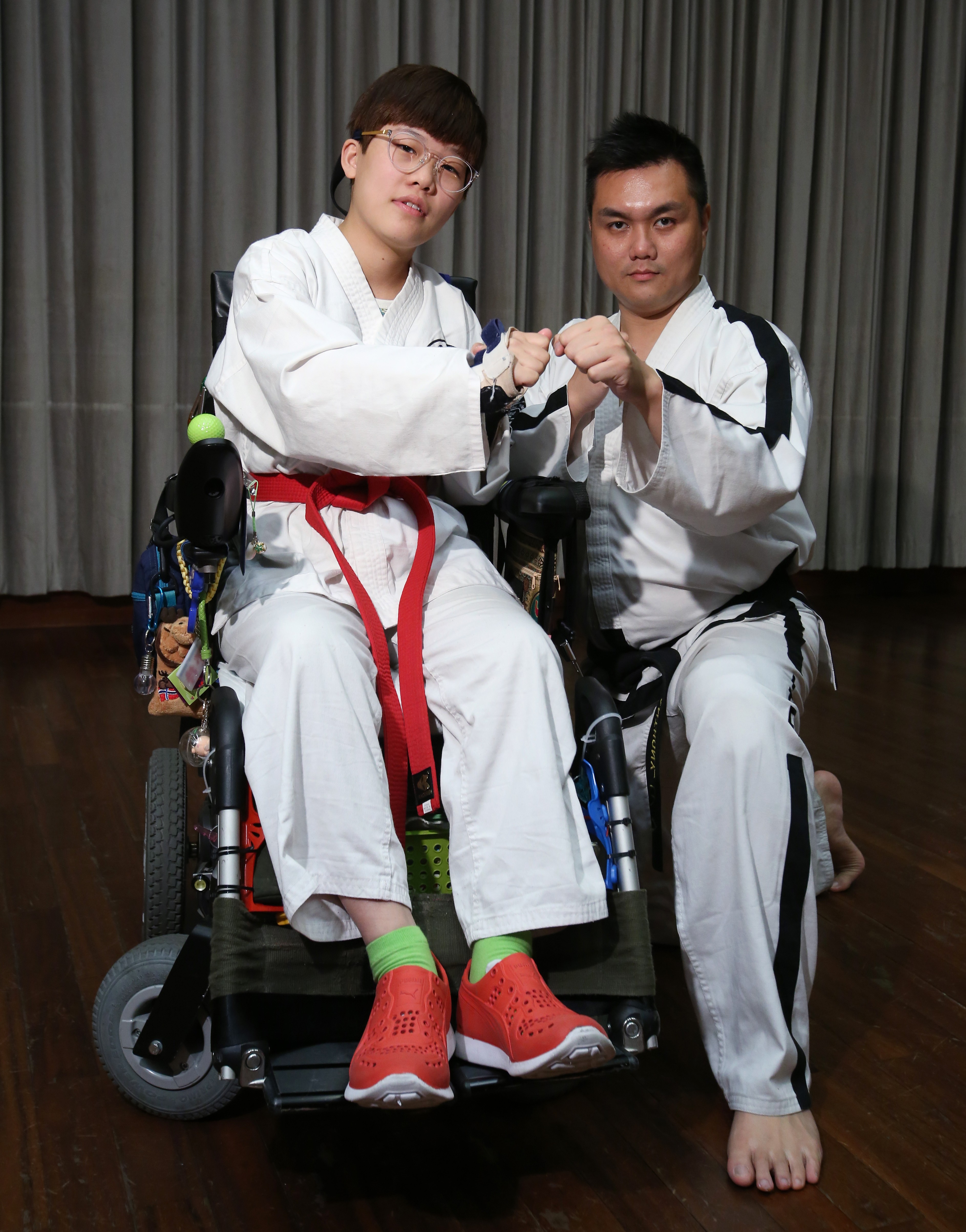 Chan Ka-man with her coach Anthony Li, president of the Hong Kong PHAB Martial Art Association. Photo: Edmond So