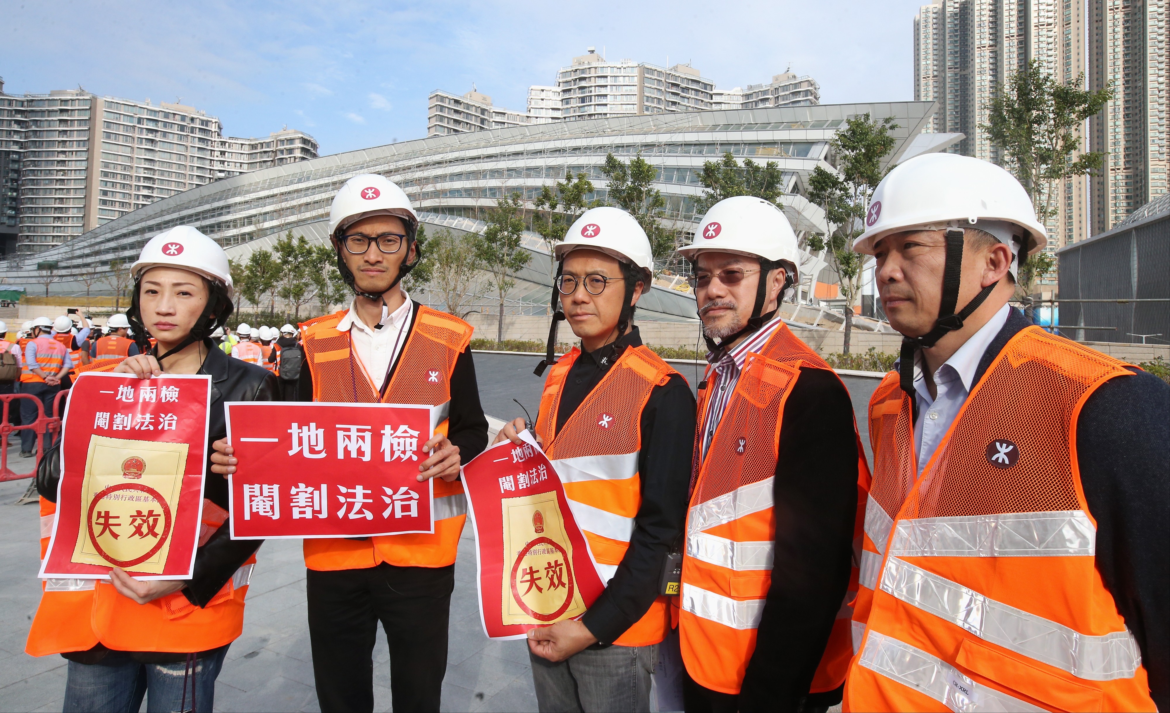 Hong Kong’s opposition lawmakers, including (from left) Tanya Chan and Eddie Chu Hoi-dick, protest against the proposed joint immigration checkpoint, in front of the West Kowloon terminus of the high-speed rail link, on February 27. Photo: David Wong