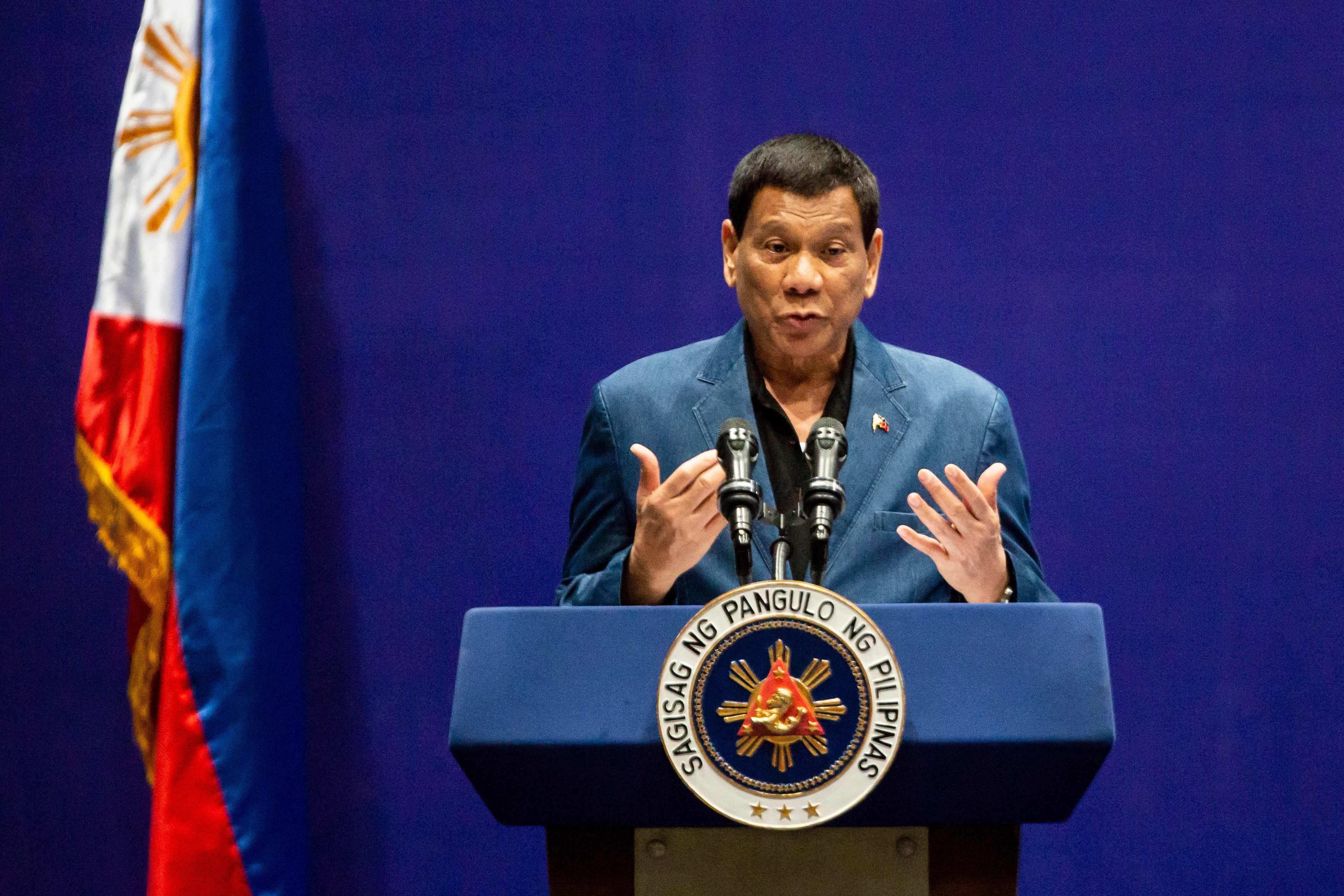 Duterte addresses the crowd at Kai Tak Cruise Terminal. Photo: AFP