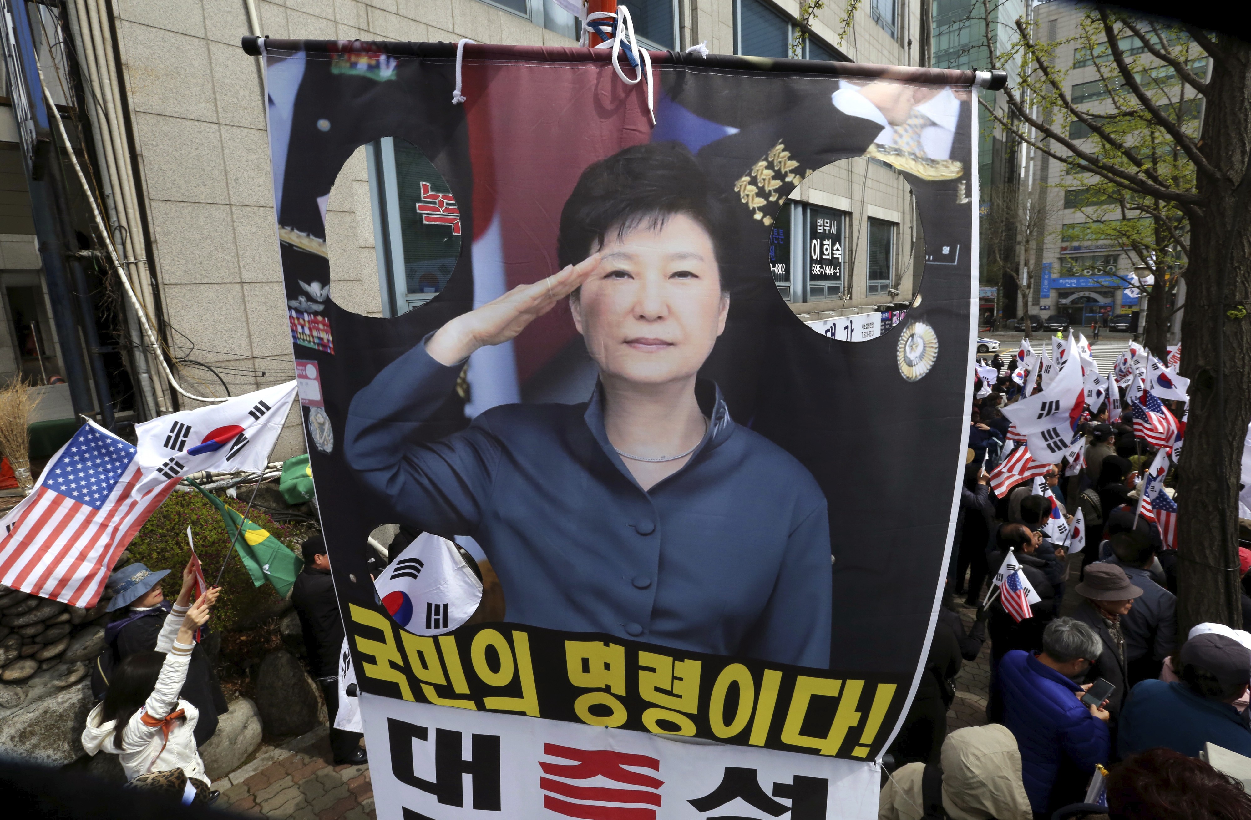 A portrait of South Korean President Park Geun-hye at a supporters’ rally. Photo: AP