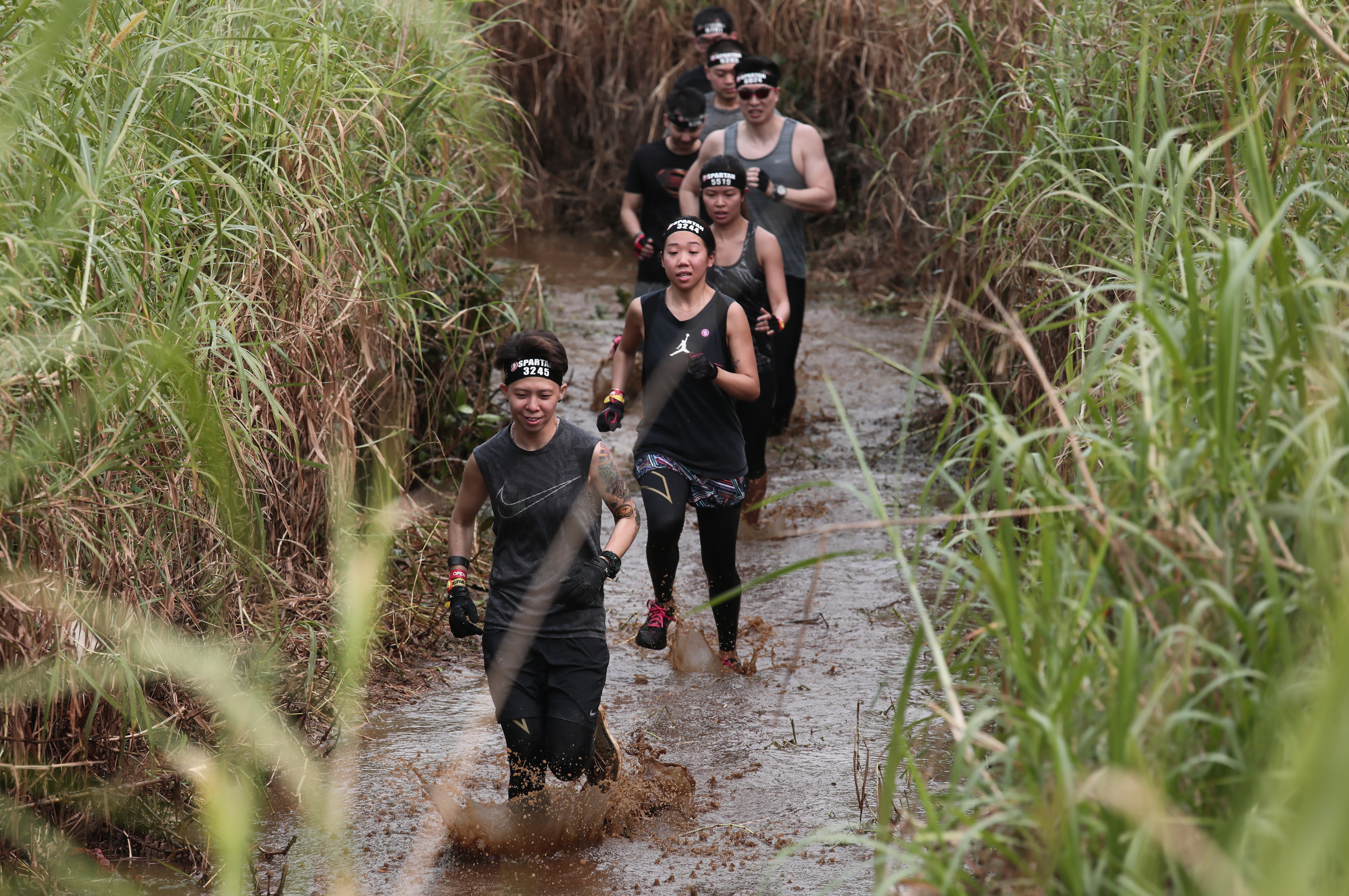 The Spartan Race starts with a run through mud. To our horror, we found out this did no count as one of the 20 obstacles. Photos: Jonathan Wong