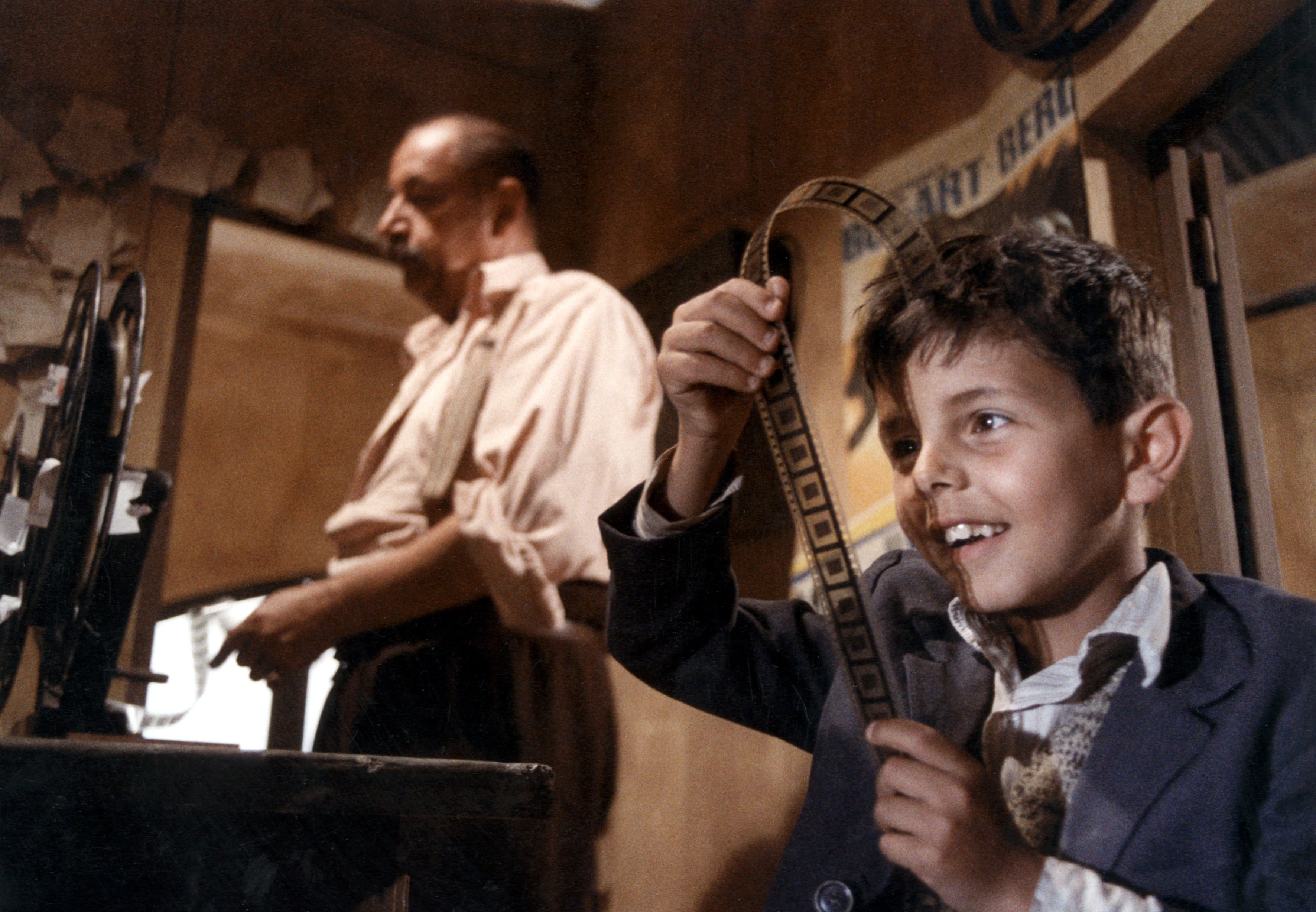 Salvatore Cascio (right) and Philippe Noiret in Cinema Paradiso.