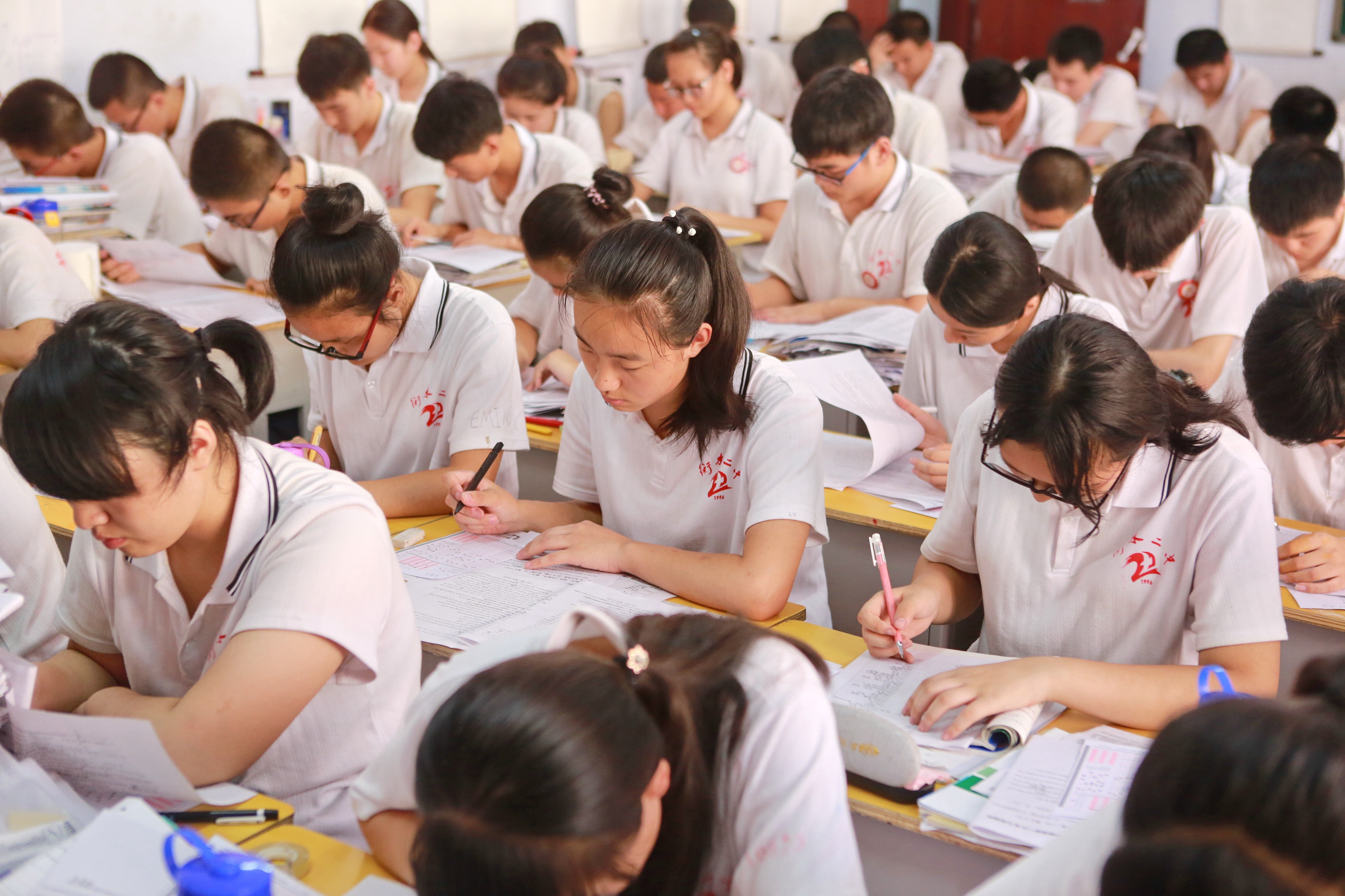 Candidates for the national college entrance exam revise at No. 2 Middle School in Hengshui, Hebei province, China, in June 2017. As competition for entry to China’s universities intensifies, the education sector has flourished. Photo: Xinhua