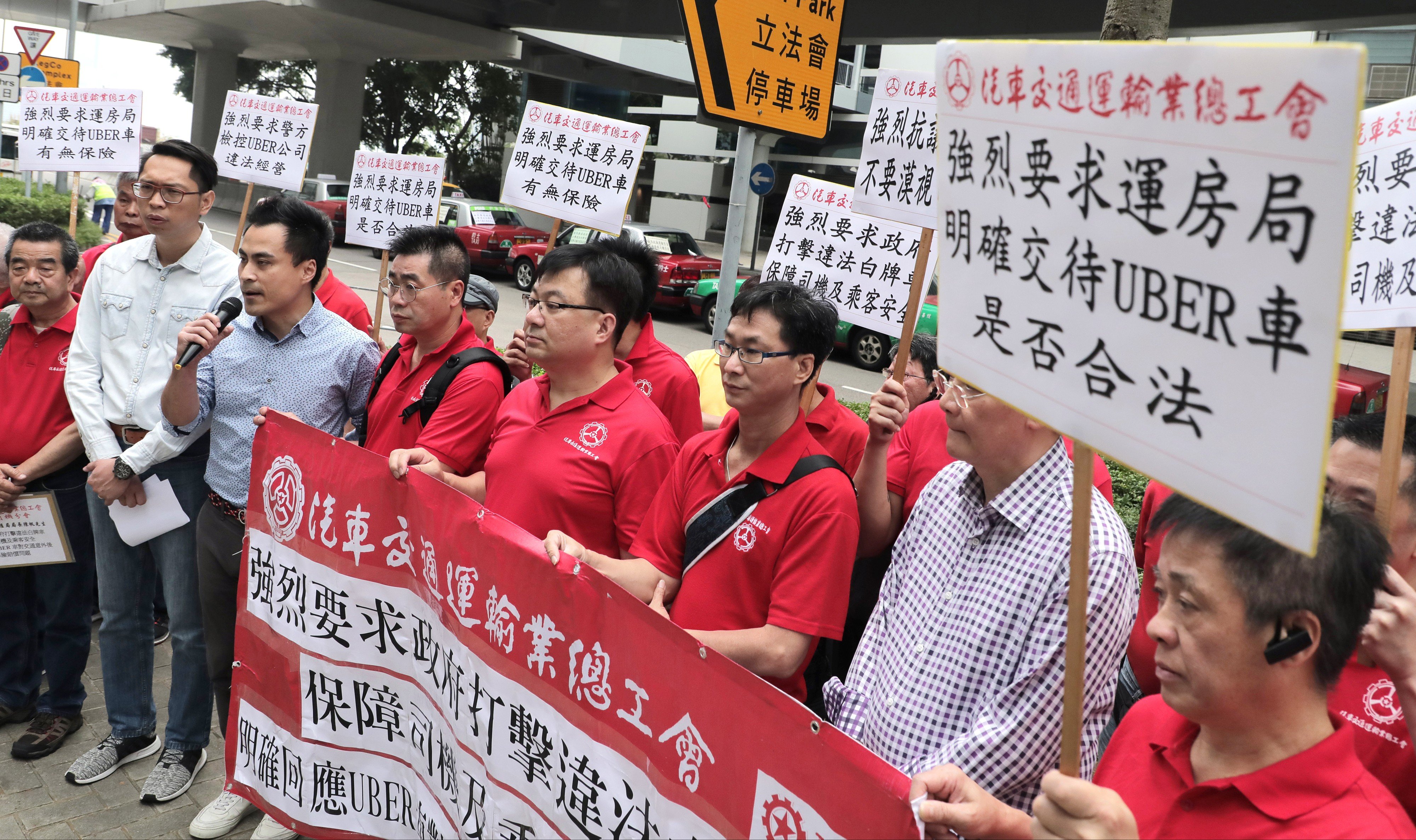 Taxi groups demand a crackdown on car-hire services such as Uber. Photo: SCMP Pictures