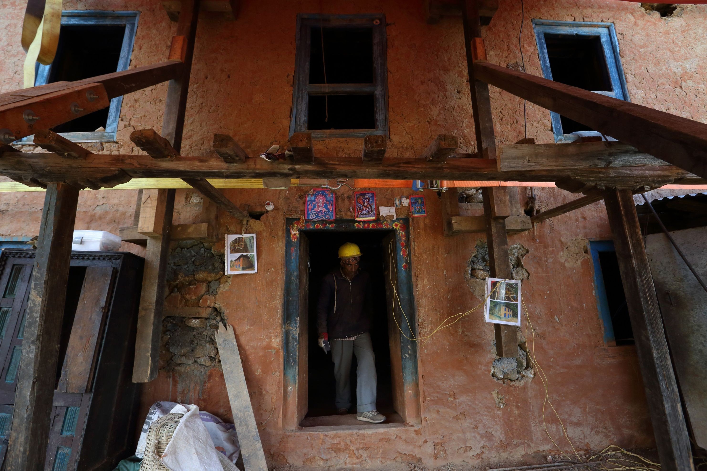 An earthquake-damaged house secured for retrofitting in the village of Dungkharka in Kavre district, some 45km east of Kathmandu. Photo: AFP