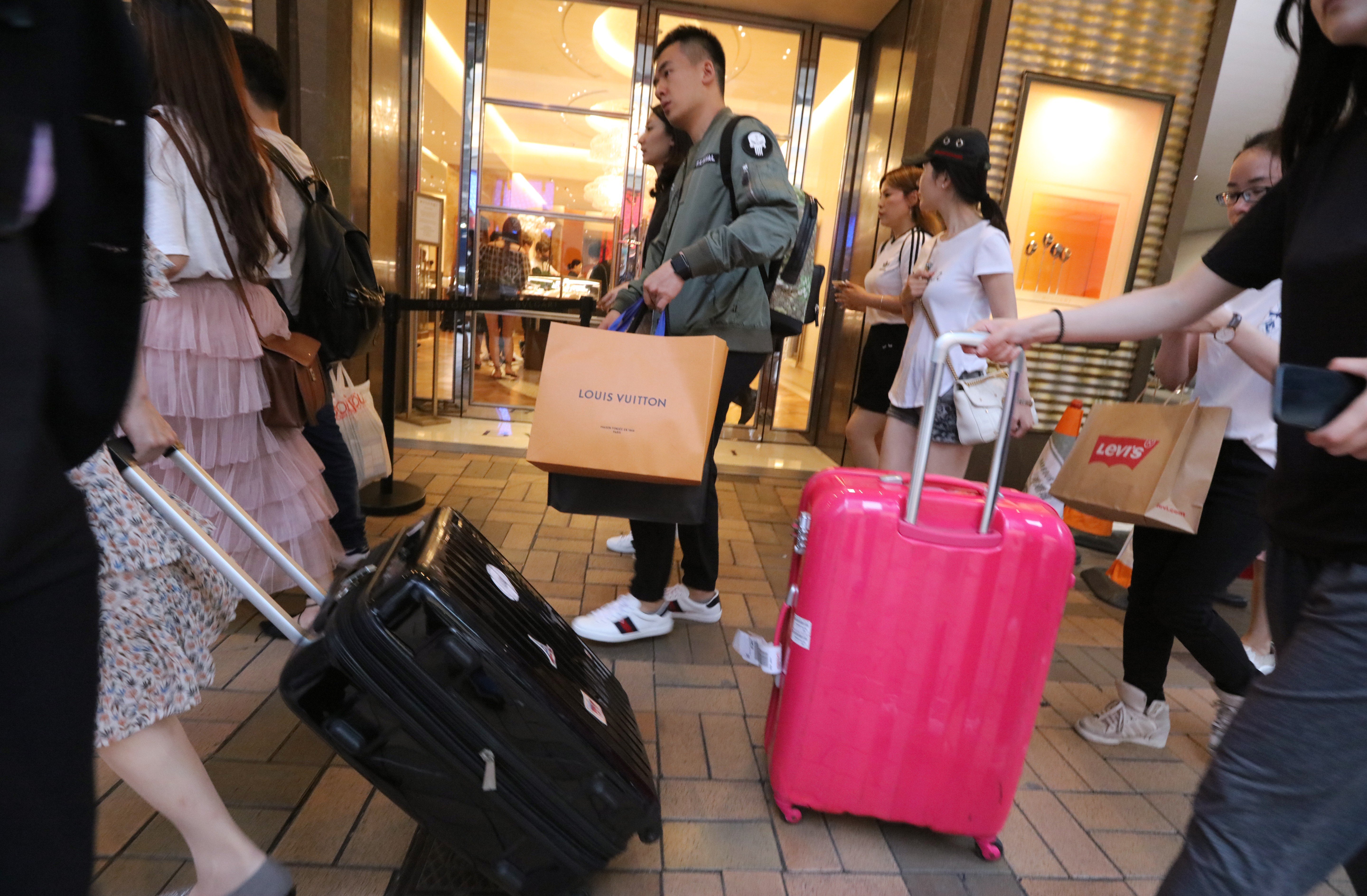 Jump in latest tourist figures year on year to nearly 5 million visitors points to recovering local economy on strength of cash-rich mainlanders