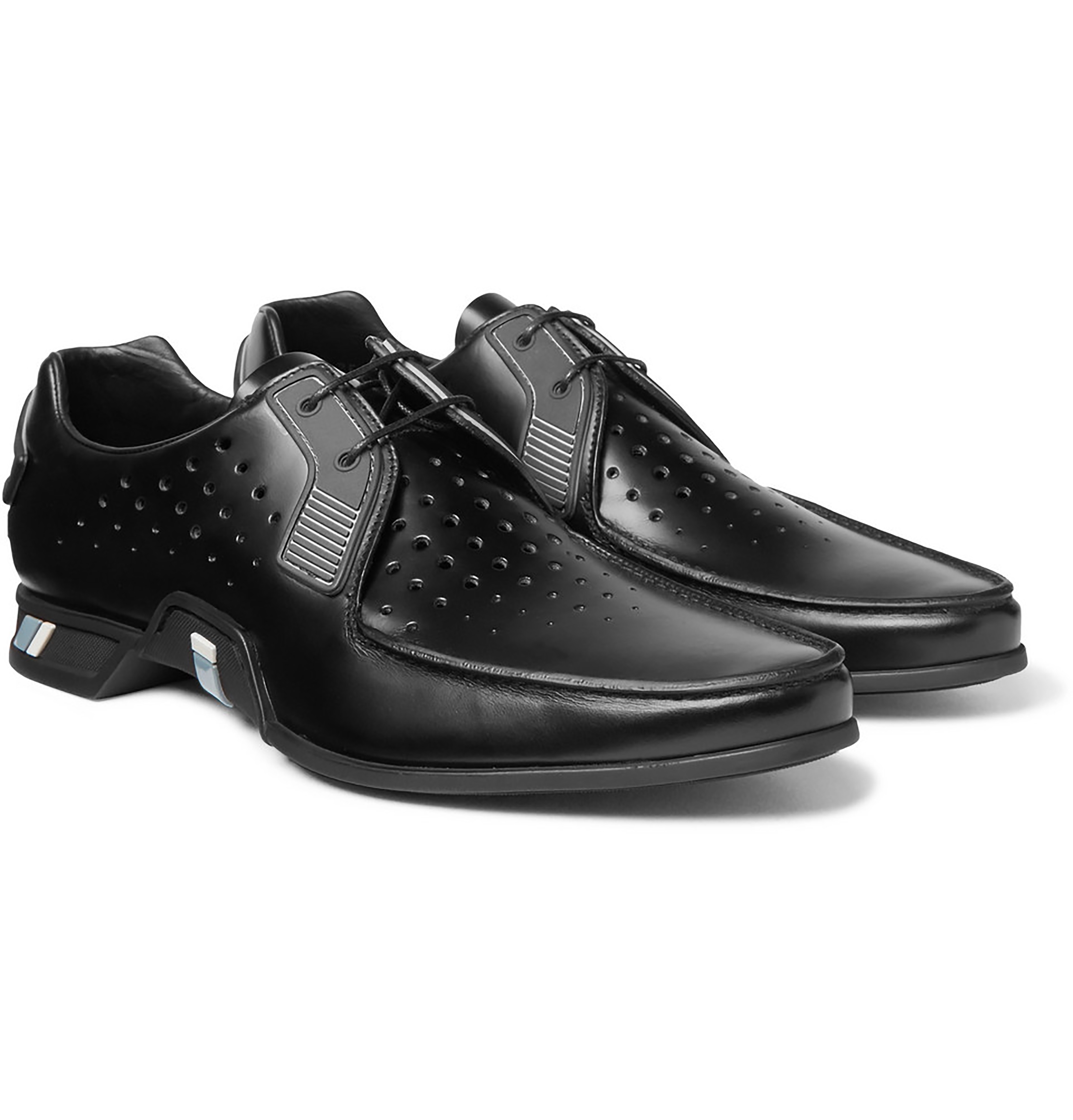 Parda These ultramodern spazzolato derbys are equipped with graphic perforations - an example of Prada's reference to 90s-comics in the men's Fall 2018 collection. The shoes' sharp silhouette boasts the house's novel design language.