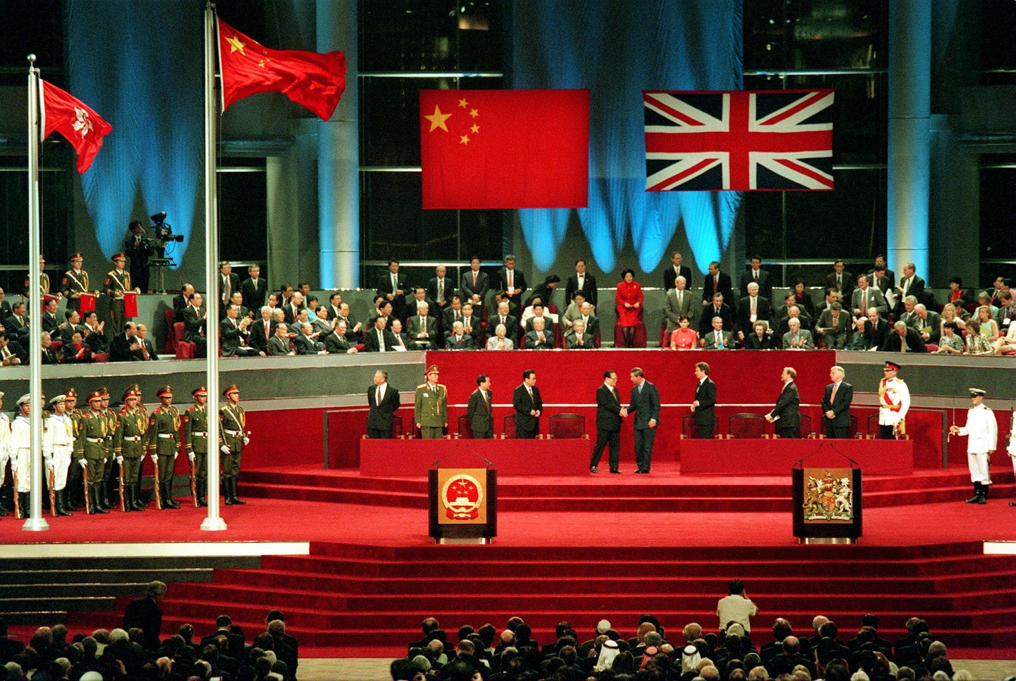 Jiang Zemin shakes hands with Charles, Prince of Wales at the handover ceremony for Hong Kong at midnight on June 30, 1997. Photo: Handout
