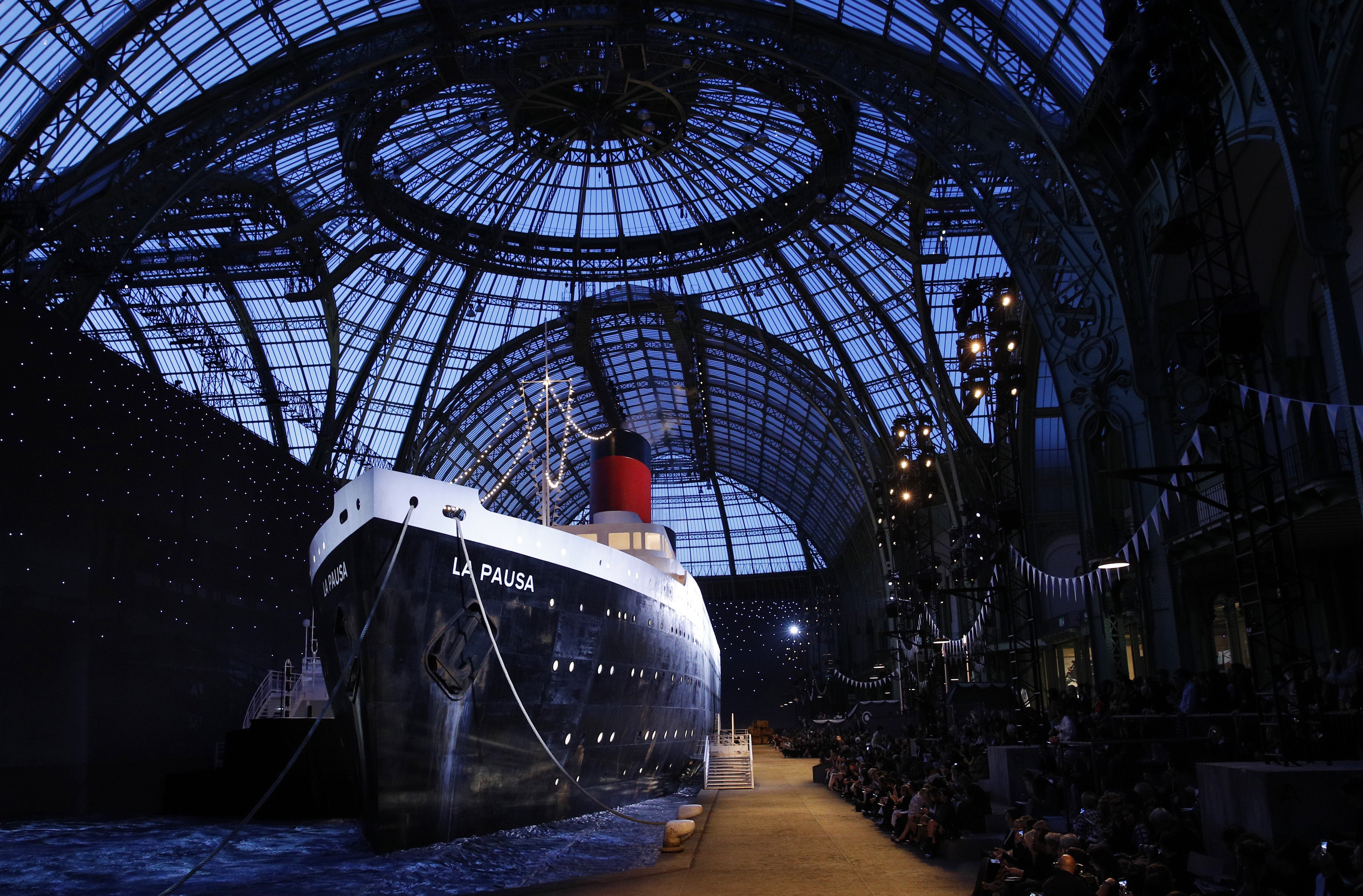 French fashion brand Chanel’s stunning 30-foot- (100-metre-) long cruise liner – with steaming funnels and a gangplank – forms the setting of its Cruise collection fashion show and after-party, inside the Grand Palais, in Paris, France, last Thursday. Photo: AP