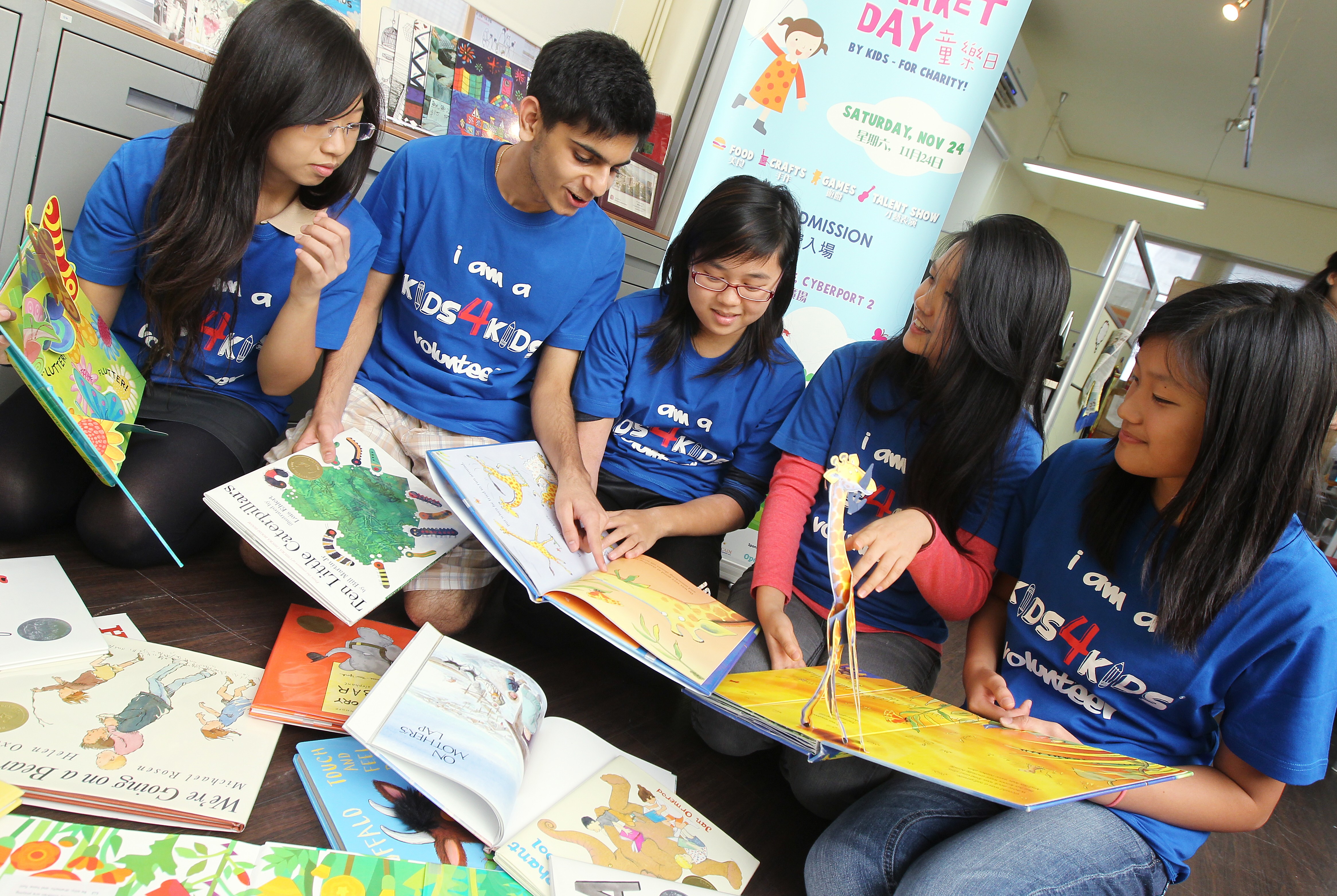Secondary school volunteers of the Kids4Kids youth-oriented NGO share the joys of reading, in November 2012. Photo: K.Y. Cheng