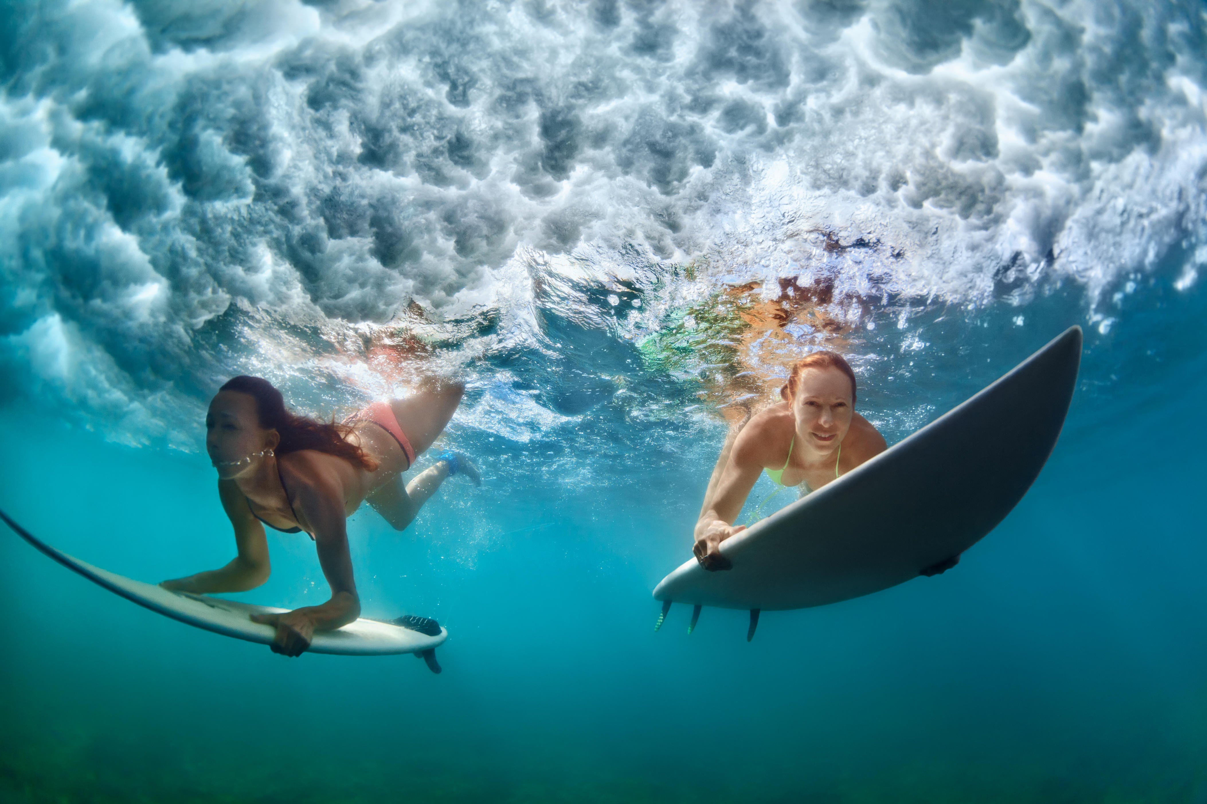 Learning to surf can be daunting, but it is not as hard as it looks with the right help. We have a list of surf schools to get you standing on your board in no time. Photo: Alamy