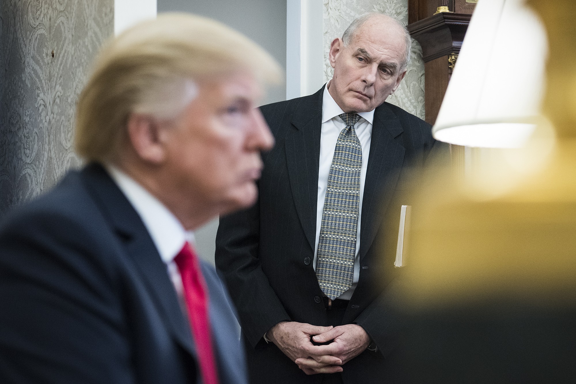 White House Chief of Staff John Kelly watches as US President Donald Trump speaks during a meeting with North Korean defectors in the Oval Office in February. Kelly’s recent comments on immigrants have caused a furore. Photo: Washington Post