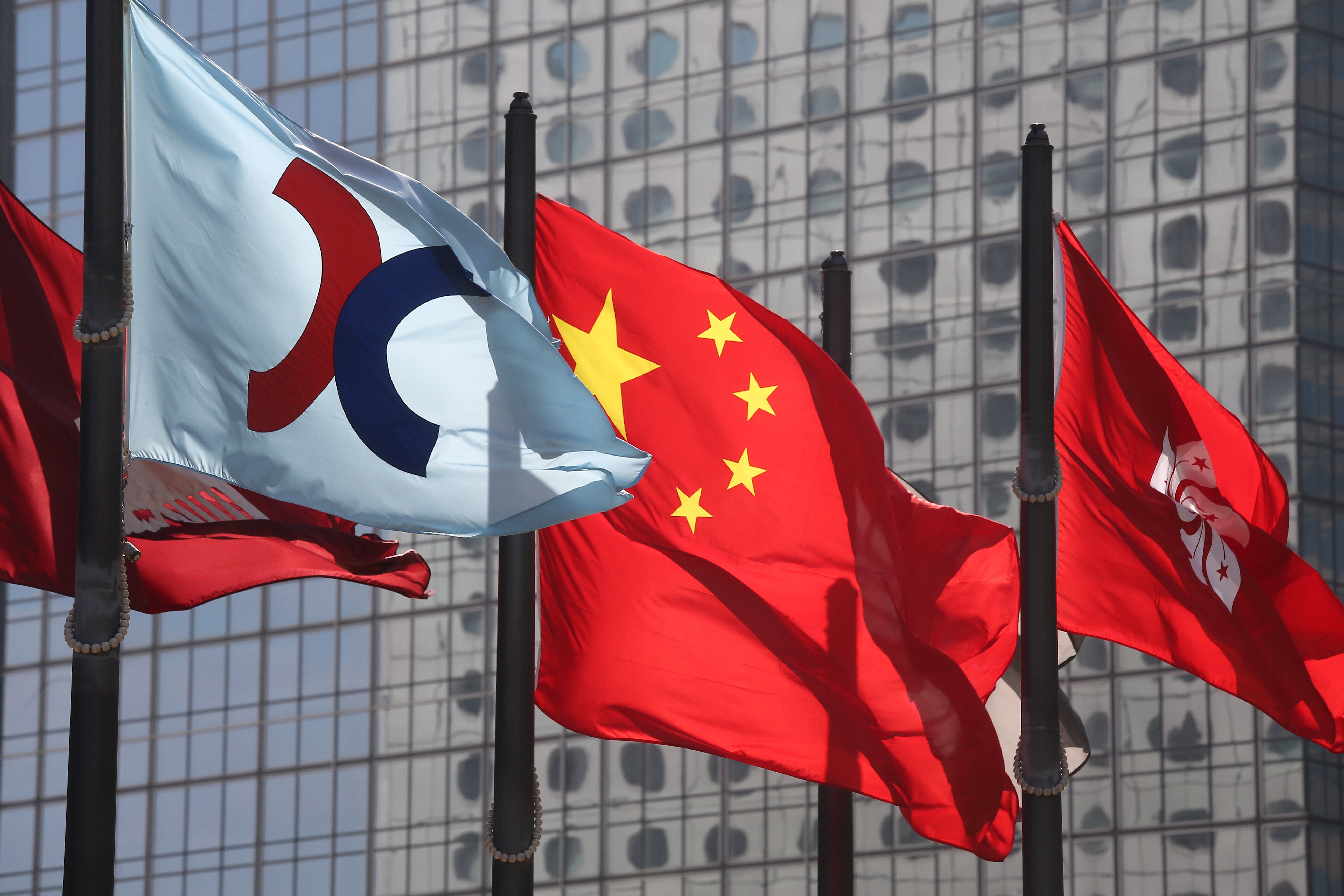 The Hong Kong stock exchange, China and Hong Kong flags flutter outside the Hong Kong stock exchange in Central. Photo: SCMP