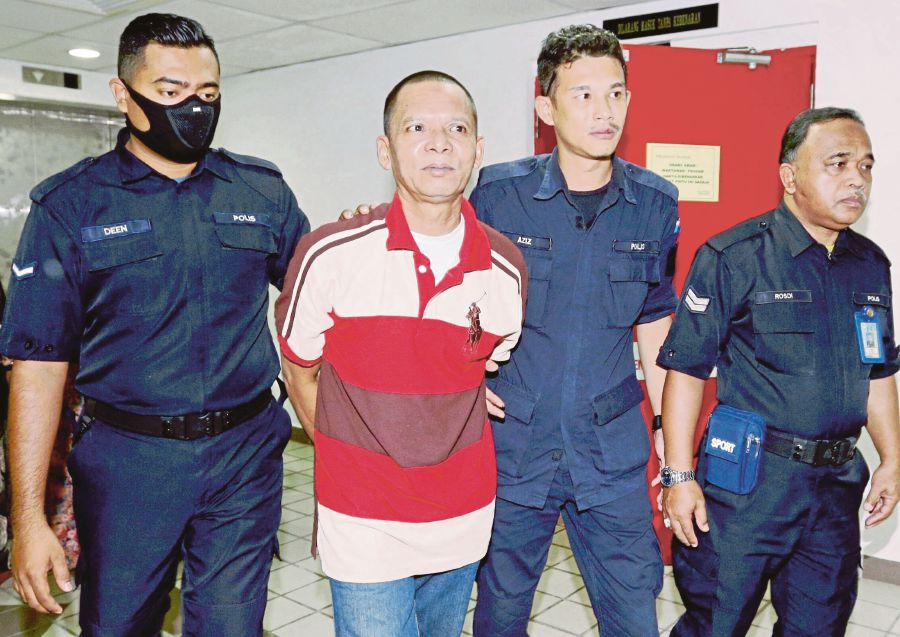 Zulkifli was charged with the murder of metal scrap collector Zulkefle Abdullah. Photo: NSTP/ROZAINAH ZAKARIA