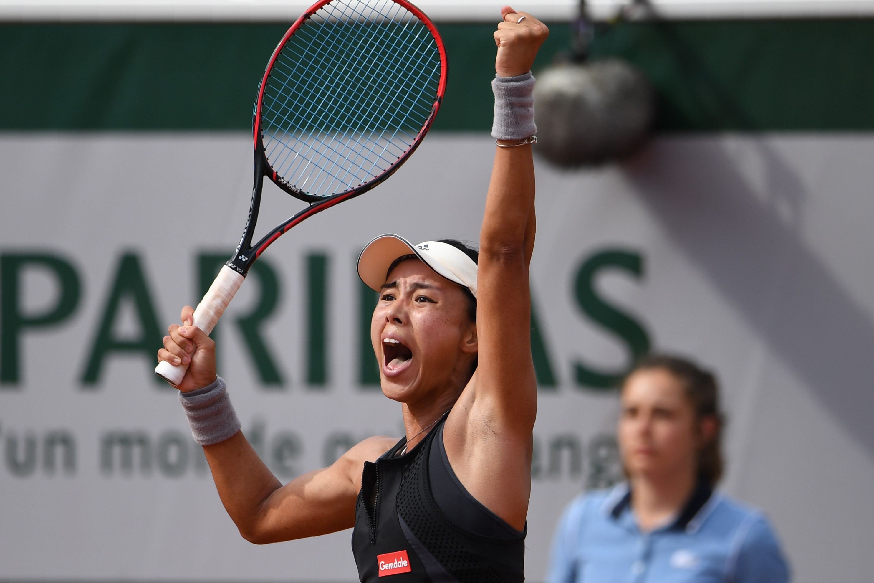 China's Wang Qiang celebrates after beating American Venus Williams at the French Open. Photo: AFP