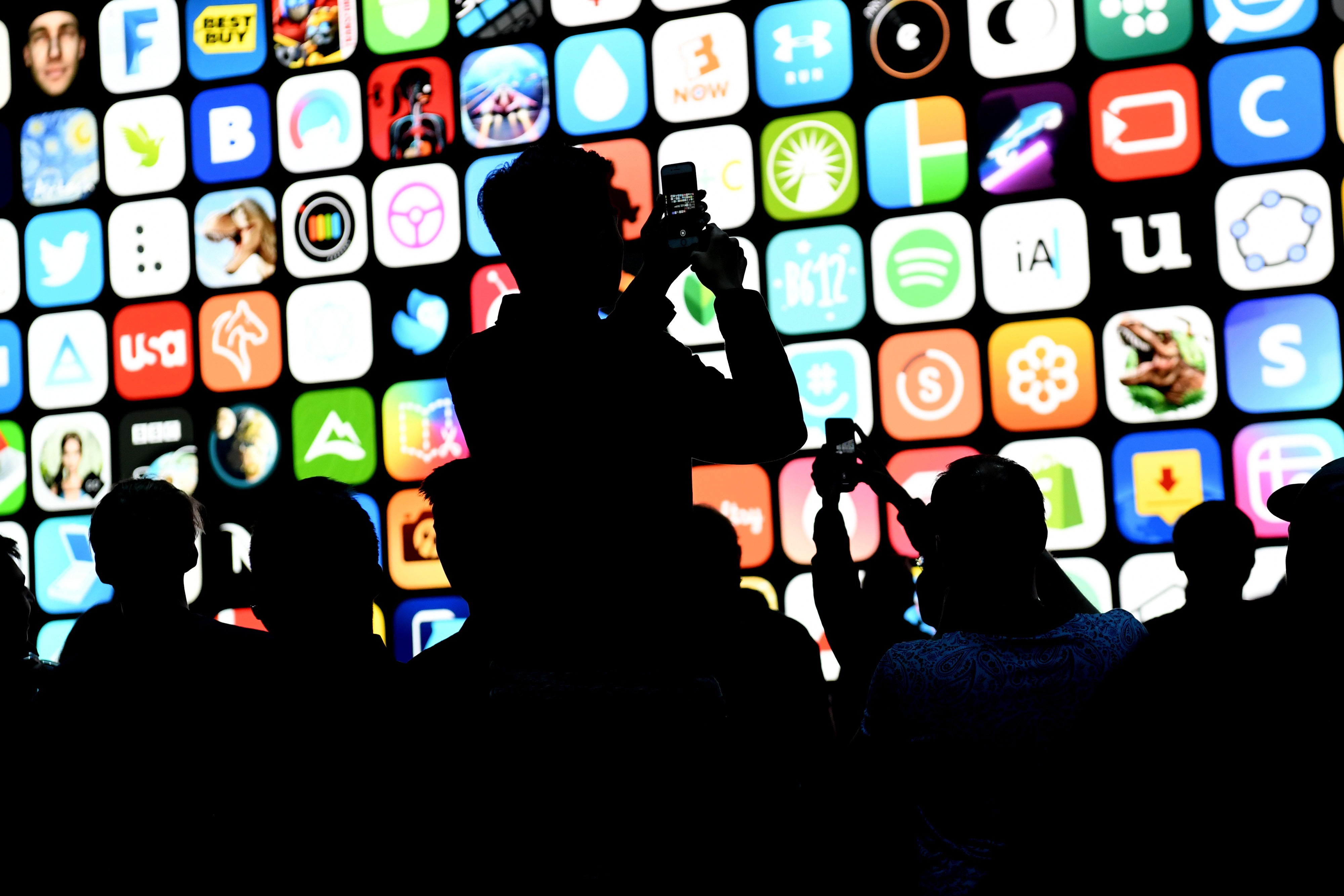 The silhouettes of attendees before the start of the Apple Worldwide Developers Conference in San Jose. Photo: Bloomberg