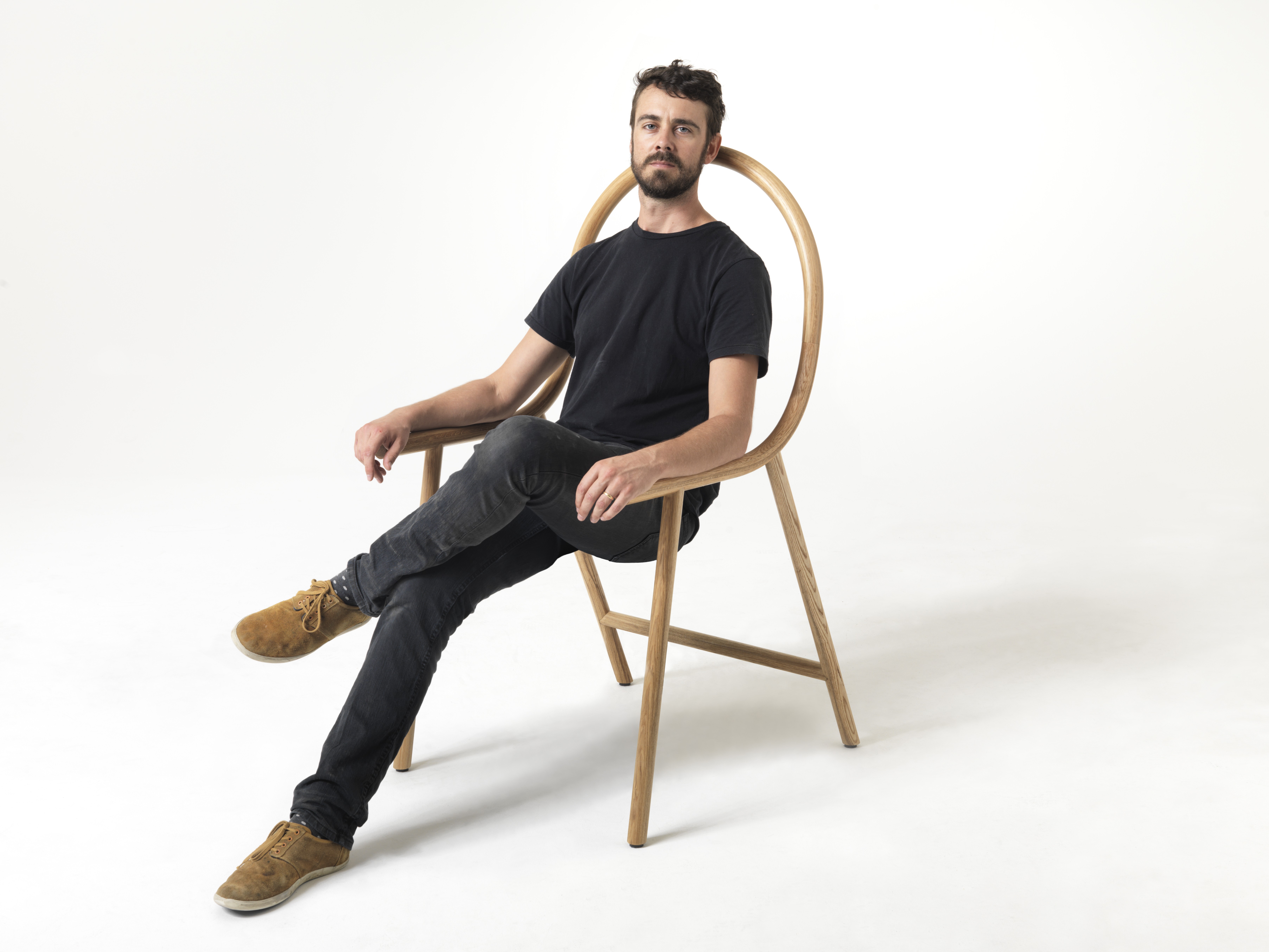 New Zealand furniture designer Clark Bardsley and his Arm chair.