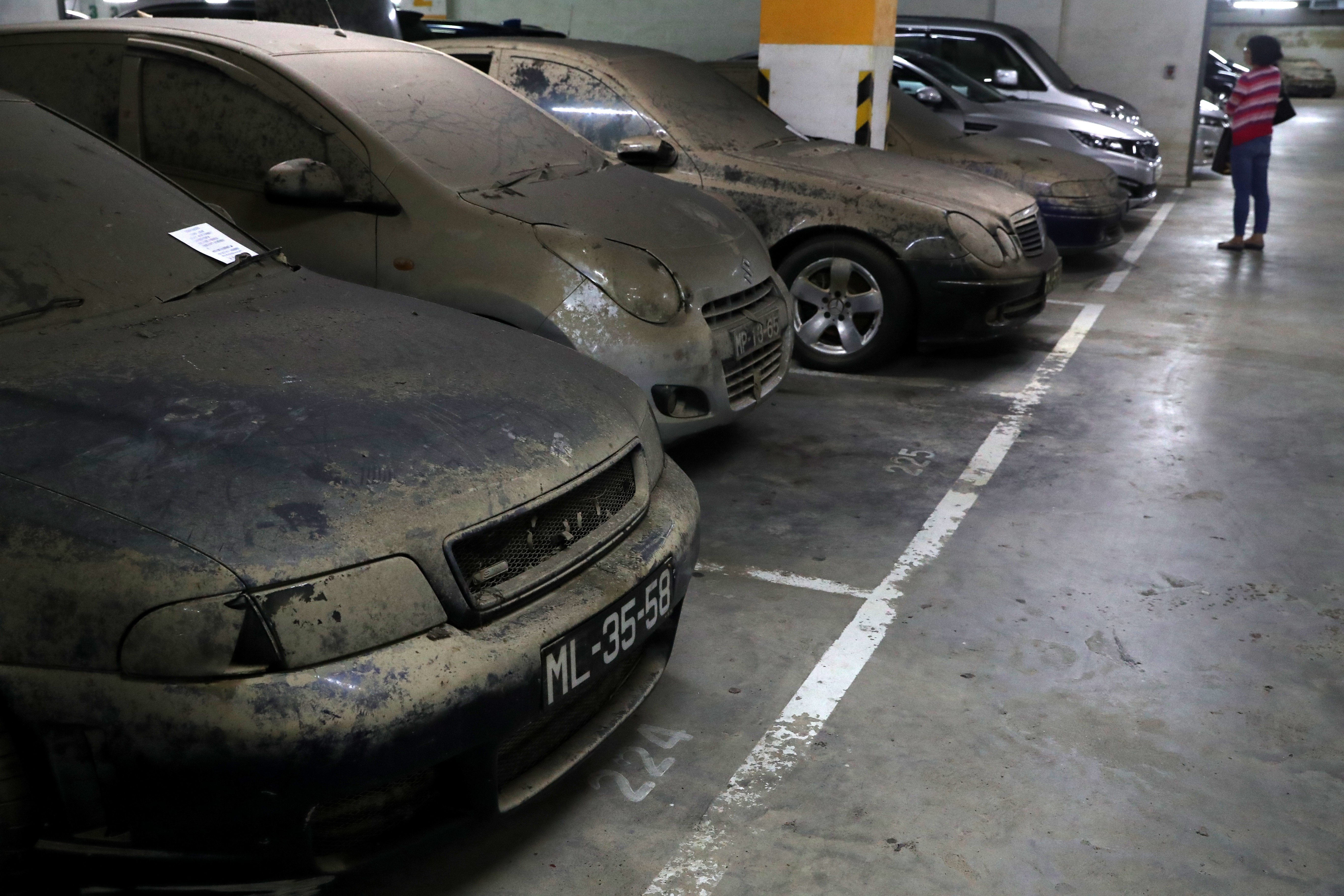 Damaged vehicles left at a basement car park near the Macau-Zhuhai border reflect a growing problem with the city’s infrastructure. Photo: K.Y. Cheng