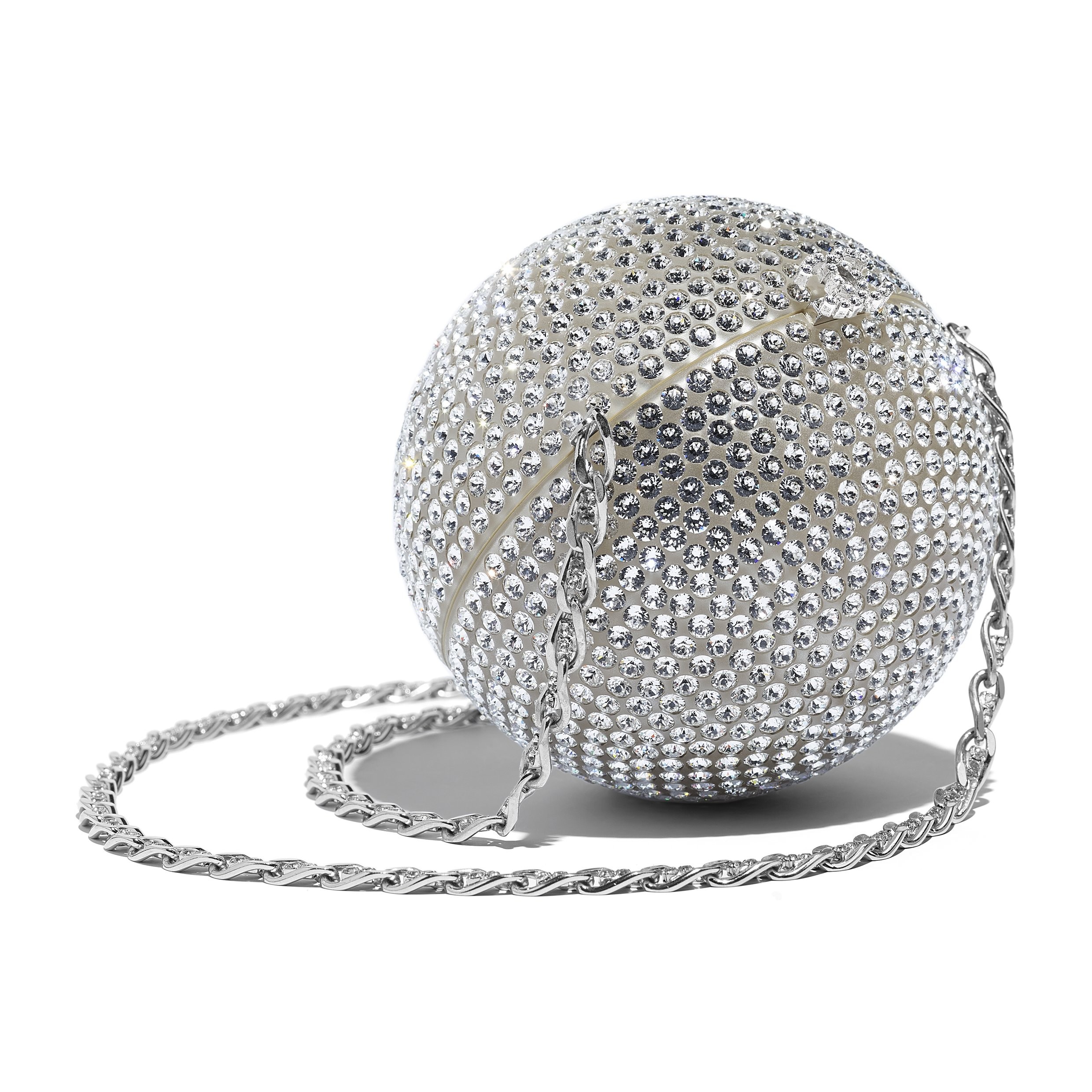 Chanel. Featuring a unique design, the silver minaudière in metal leather and strass is perfect for a night out, HK$115,900